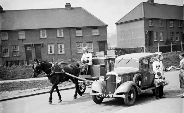 1936 Express Dairy delivery horse and cart overtakes an Express Dairy Bedford van CXR 270, Co Num 267 (Courtesy TopFoto)