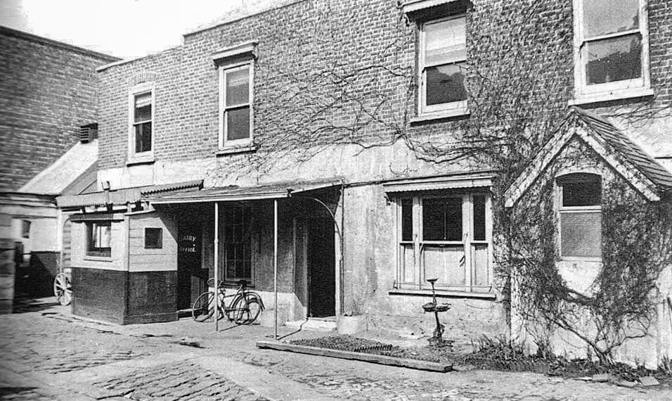 1929 Glover's Dairy, Hammersmith. Julia comments "That's the wall of the Hammersmith Palais on the left which was built 10 years earlier in 1919 on the site of Glovers Farm. This photo shows the Express Dairy which bought the other half of the site in 1928 taking over what was previously the Glover Dairy Farm office. Paul Luckett adds "The site was opposite "Luckett's Cottages" (1881 census) now the public library." (Courtesy Julia Thomas Arning)