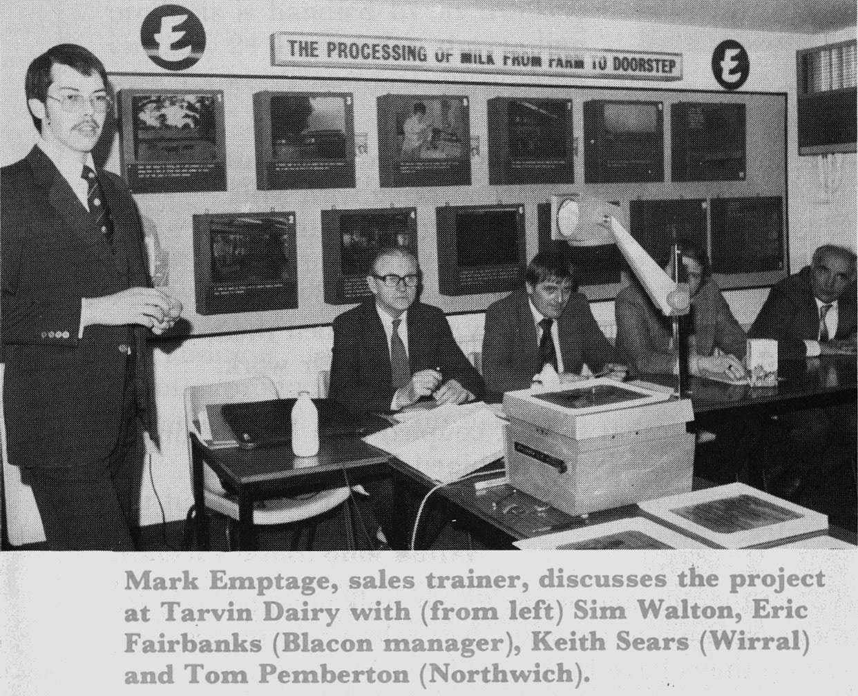 1981 Sales trainer Mark Empage discusses a new sales project with Sim Walton, Eric Fairbanks (Blacon Manager), Keith Sears (Wirral) and Tom Pemberton (Northwich).  (April Express News)