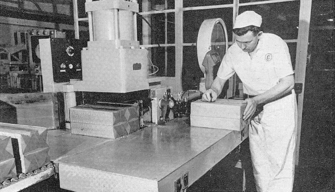 1967 Sanquhar Creamery. Mr David Beck heat-seals and weighs the finished blocks which will later mature in store for anything up to a year.