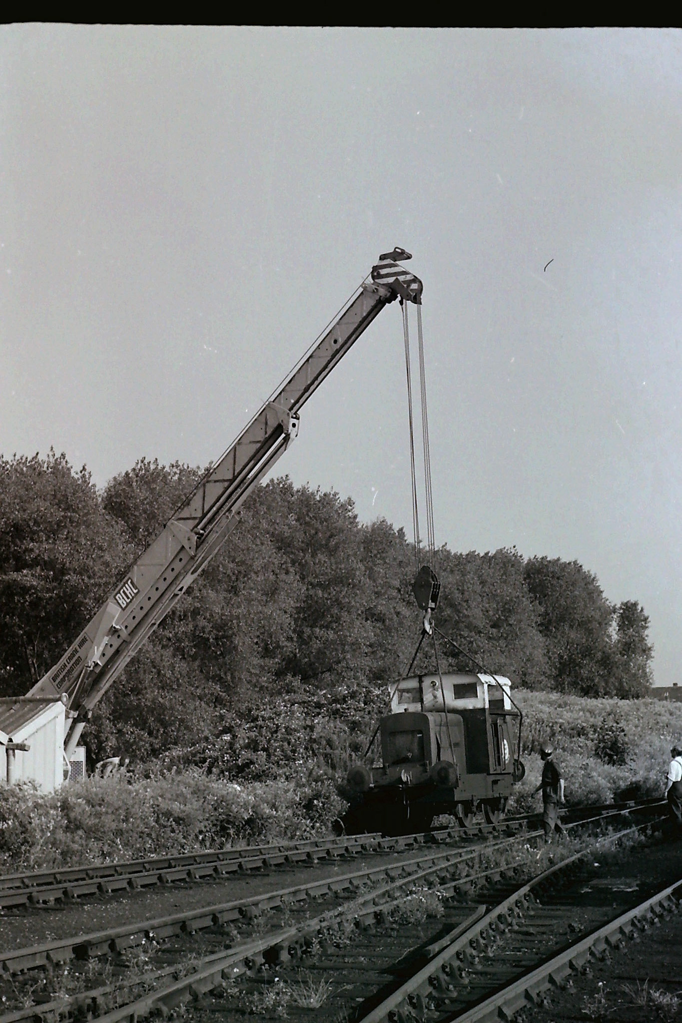 1972 Ruston 48DS 235511 being lifted out by crane into the car park on 26th July to be taken by road to the Ashford Steam Centre. Possibly Brian Wallis, plant engineer, directing the crane in white shirt?  Raffaele Ralph Phillips comments "This shunter was in use when I joined the company in 1970-as an apprentice vehicle electrician I had to check the batteries and some basic electric circuits whilst in service, also checking the charging system on the shunter which involved starting her up! (Picture by Sam Jones, courtesy Geoff Smith)