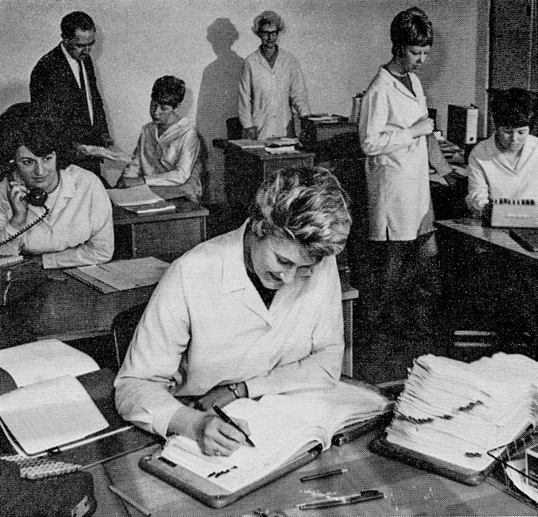 1968 Wakefield. General Office staff, clockwise from the front, Mrs Mavis Cartledge, Mrs Jean Sanderson (whose husband Trevor and father Jim Firth are pillars of the processing staff), Office Manager Alan Ward, Ann Robinson, Mrs Muriel Godsoe, Joan Middleton, who acts as secretary to the management, and Carol Sandy. (Express News Summer)