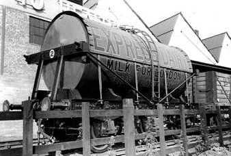1931 Express Rail Tank. Matthew Pinto comments "One of the very first 6-wheeled milk tanks built by the London, Midland and Scottish Railway for Express Dairies (earlier rail tanks were 4-wheeled and rode very roughly at high speeds). It is shown here at Cricklewood depot. Note the semi-cylindrical sunshade. These were common on early tanks but their effectiveness was questionable and the feature was eventually abandoned." (Courtesy Richard Gaylard)