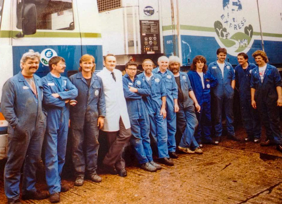 1980's Exeter Vehicle Workshop staff. Jimmy Reid and Gillian Chambers identify, L to R: Roy Edwardson, ?, Paul Holmes, Chris Sercombe, Bill Tapp, ?, Don Holding, Steve Yates, Marcus Saunders, Andy Callaghan, Mike Knight, John Boucher. Carol Browning says "What wonderful memories come flooding back."(Courtesy Phillip Budd)