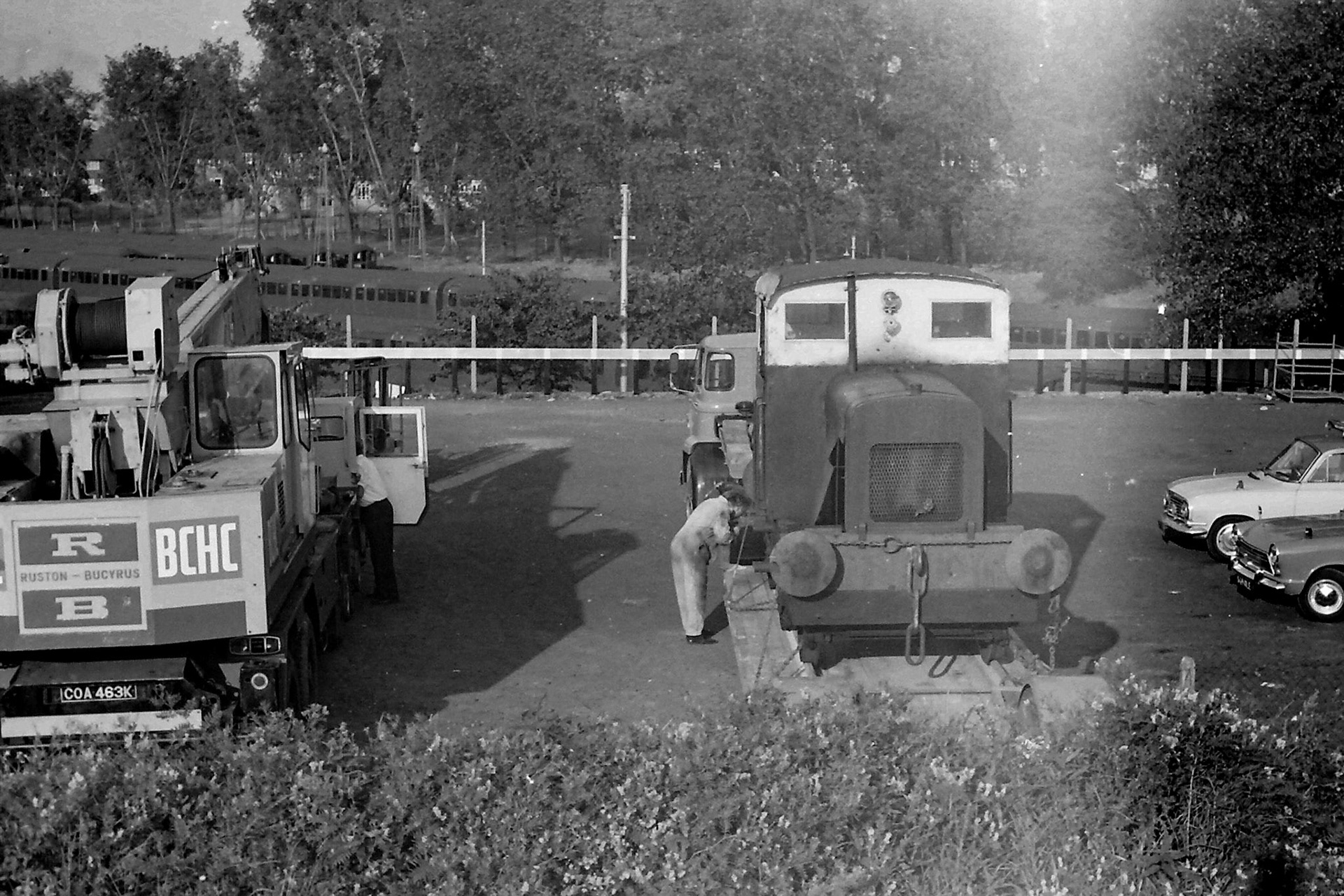 1972 Ruston 48DS 235511 being lifted out by crane into the car park on 26th July to be taken by road to the Ashford Steam Centre. Possibly Brian Wallis, plant engineer, directing the crane in white shirt?  Raffaele Ralph Phillips comments "This shunter was in use when I joined the company in 1970-as an apprentice vehicle electrician I had to check the batteries and some basic electric circuits whilst in service, also checking the charging system on the shunter which involved starting her up! (Picture by Sam Jones, courtesy Geoff Smith)