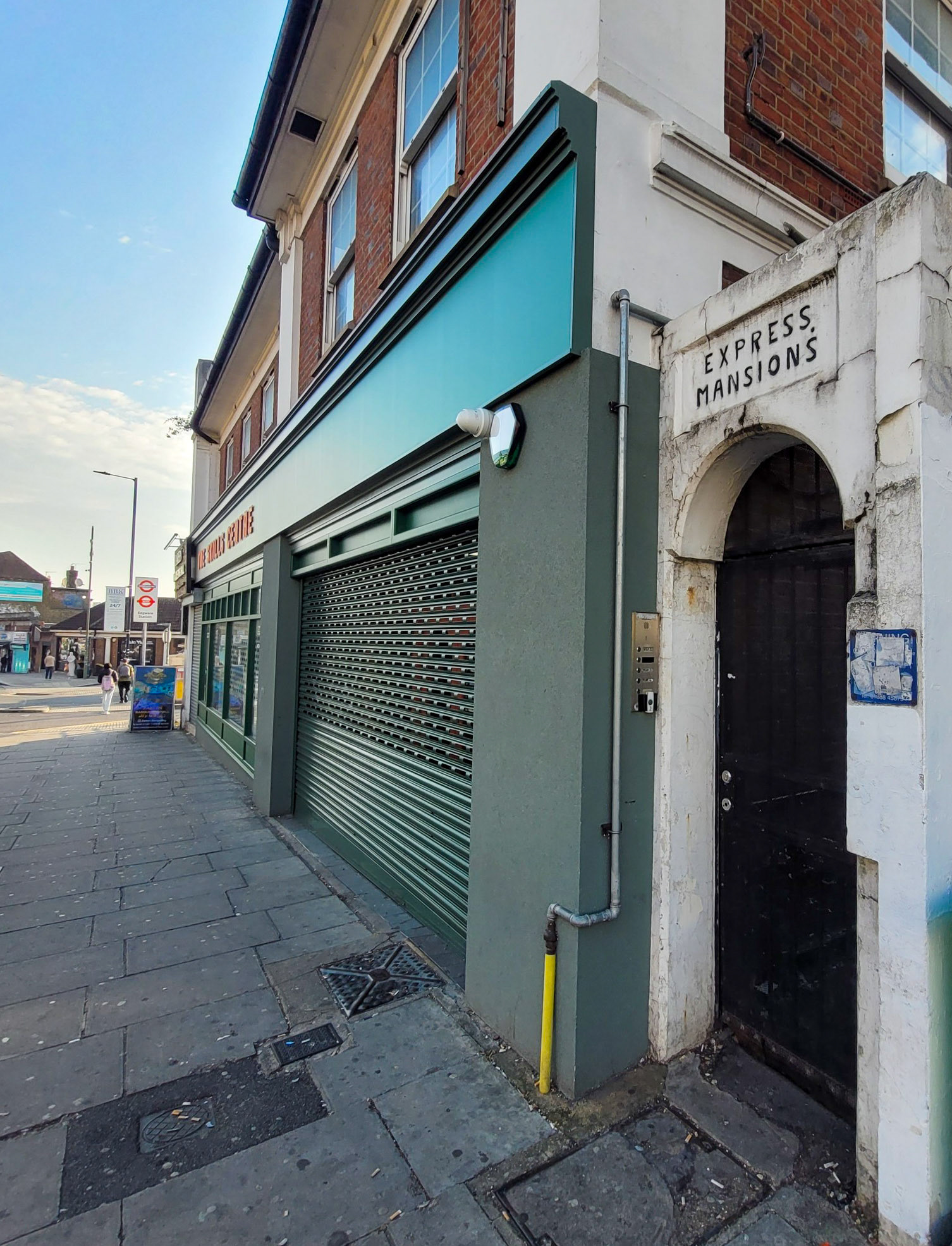 2025 Edgware Shop parade entrance to Express Mansions. Mark comments "Be aware, this building is going to be demolished in the near future, as part of Ballymore's Edgware Town Centre redevelopment." (Courtesy Mark Amies)