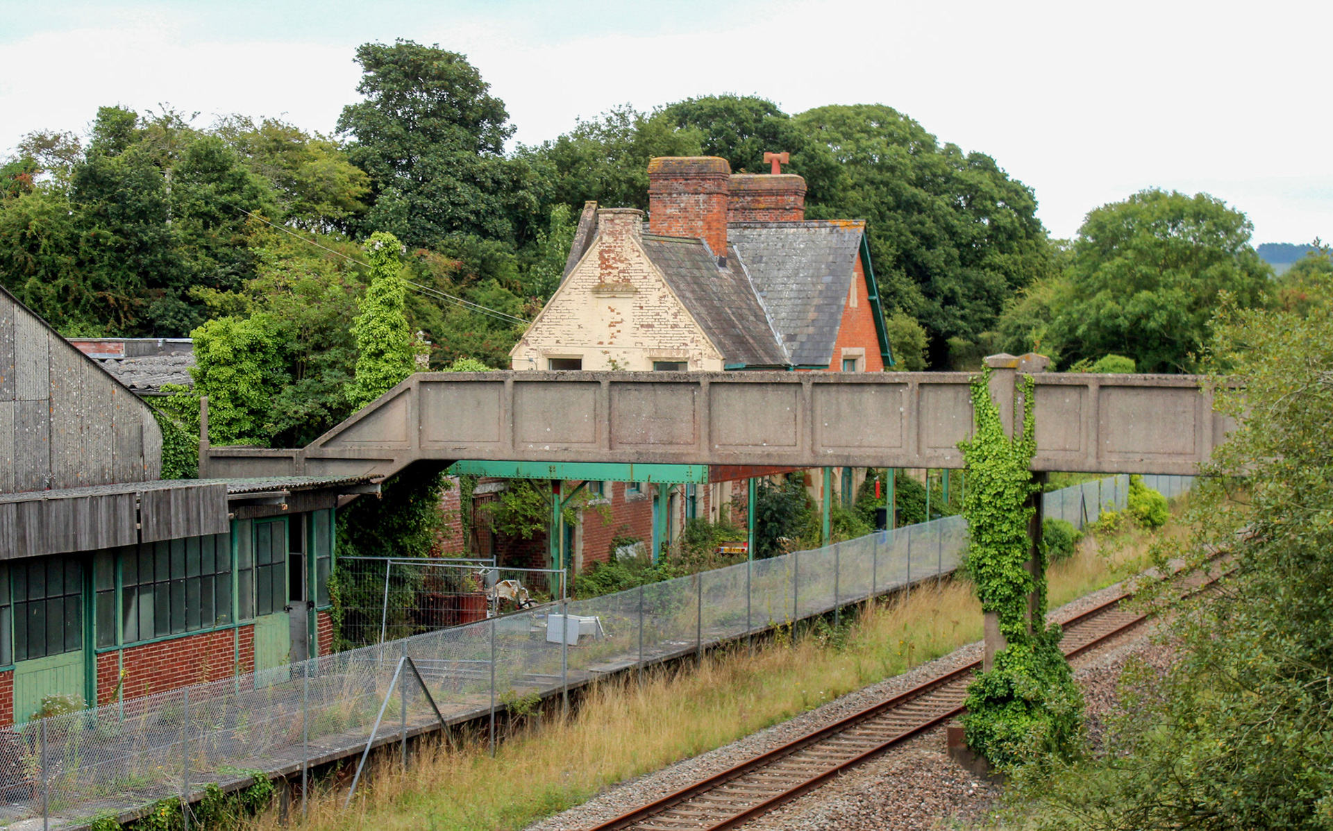 2013 Seaton Junction Railway Station, originally named 'Colyton for Seaton'; the station opened on 19 July 1860 on completion of the Exeter extension of the London and South Western Railway from Yeovil Junction to Exeter Queen Street. With the opening of the Seaton and Beer Railway on 16 March 1868 the name was changed to 'Colyton Junction' before finally becoming 'Seaton Junction' on 18 July 1869. The steady decline in holiday traffic resulting from increased car ownership in the 1960s led to a gradual run down of services and the branch line and junction station closed on 7 March 1966. Taken by Mike Cox, flickr.
