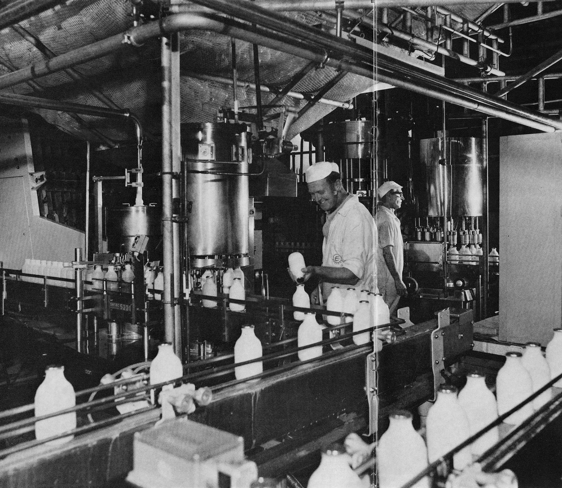 1976 No 2 Dairy filling line, nearest the camera: ex-miner and former Coldstream Guardsman Arthur Senior and, further back, Harry Griener who, with true Yorkshire grit, has taken a few major eye operations in his stride. (Express News Christmas)
