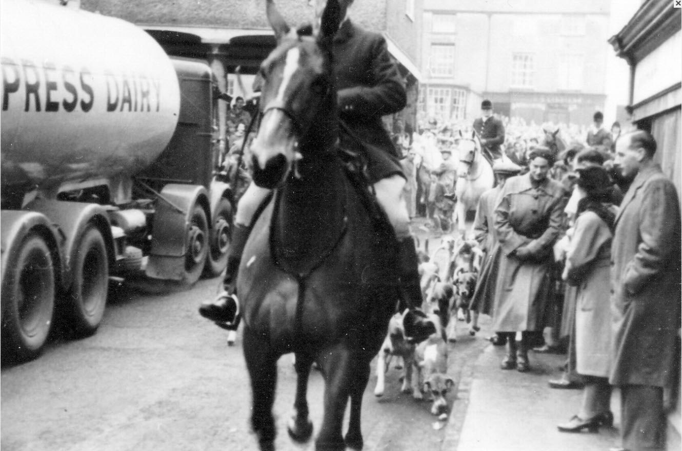 1950's Faringdon Market Place on Boxing Day, with Express Tanker making its way through the Berkshire Hunt onlookers. From the Raymond H. Hutt collection, www.fdahs.org.uk