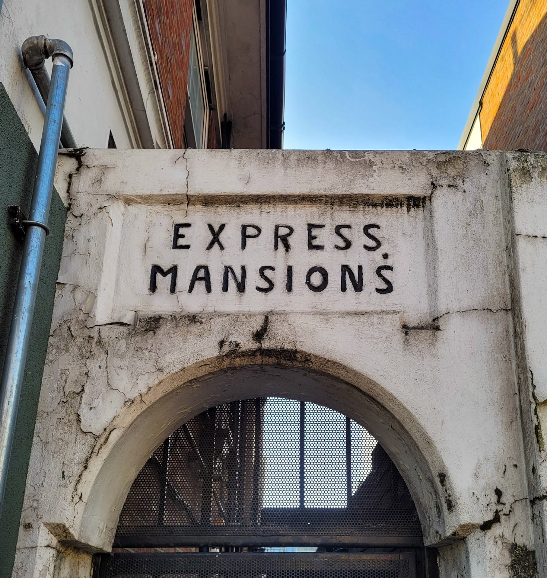 2025 Edgware Shop parade entrance to Express Mansions. Mark comments "Be aware, this building is going to be demolished in the near future, as part of Ballymore's Edgware Town Centre redevelopment." (Courtesy Mark Amies)