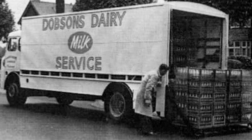 1960's? Dobson's Dairy - Unloading. Ros Hallett comments "I lived in Corringham Road in the 1950s and 60s. We had a regular milk delivery from Dobson's, and occasionally I was sent to the depot for an extra pint or so. I remember the smell of milk as you entered the yard, and tip-toeing round the puddles of water and milk spilt on the cobbles. I was also fascinated by the “clocking in” machine by the door… funny what you remember!!" (Courtesy Paul Simm)