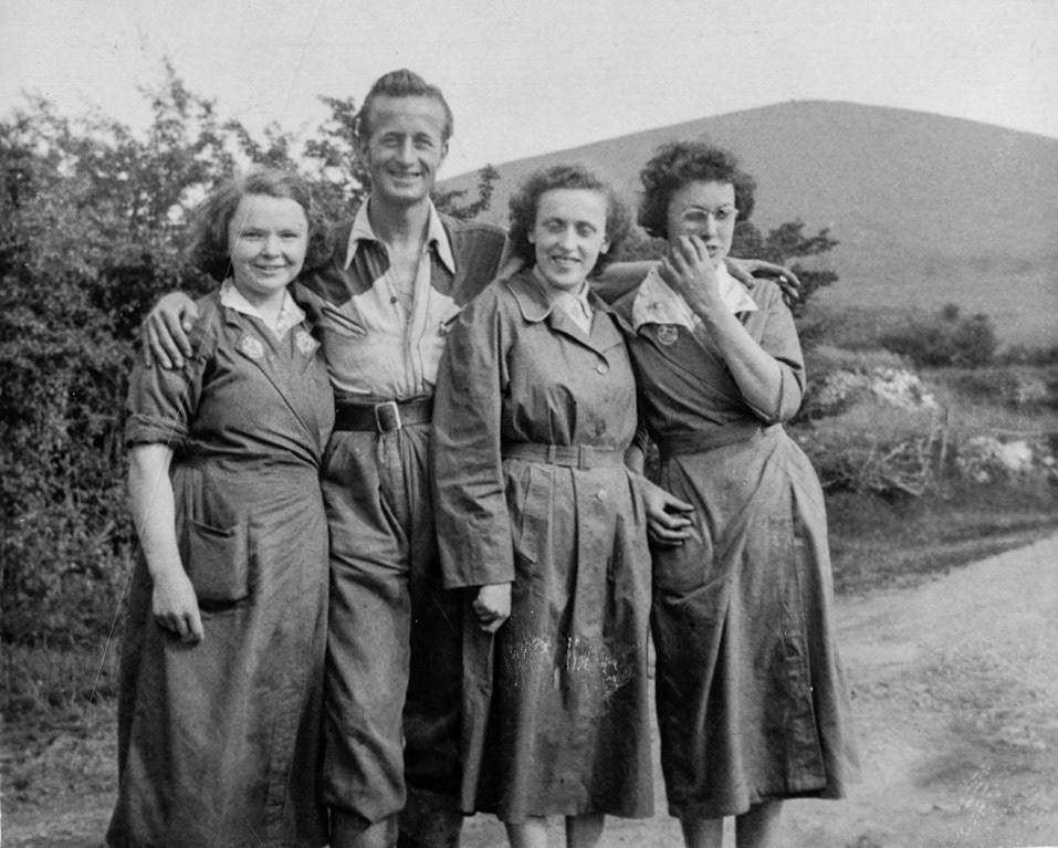 1953 Minsterley. Joe Lyons scribbled "Bill, Marj, Jean" on the back. Sharon Mitton comments "I think the second lady in from the right is Marg Delves? I think I remember Mum saying she worked in the lab." Margaret Davies confirms "L to R Joyce Wynne , Marge Delves, and Jean Broome". Monica Corfield adds "Marg and Jean are sisters, photo taken at the corner of the track to Stapeley, off to the left." Olive Booth confirms the man is Bill Lewis, from Druid's Castle. (Joe Lyons Collection)