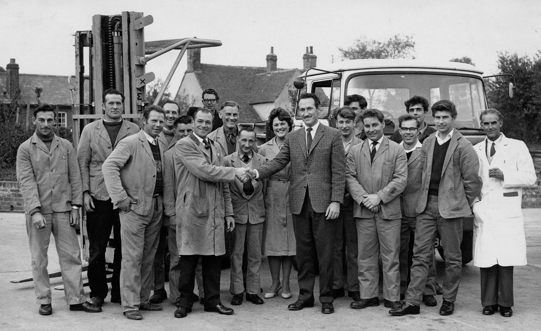 1970s? Goldhanger drivers and warehouse staff: Peter White, Fred Bowring, ?, Vic, Keith Ford, Terry Horsfell, Reg Clarke, Middle row: Lenny Dodds, ?, Herbie Quy, Freddie Ruffle, Doreen Cottee, Mr Whitney, Peter Frostick, Dougie Rayner, Alan Rosemund, Front row: Joe Kempen, Peter Seaborn. (Courtesy Karen Tuke, Tolleshunt Major in Words and Pictures old Photos on Facebook)