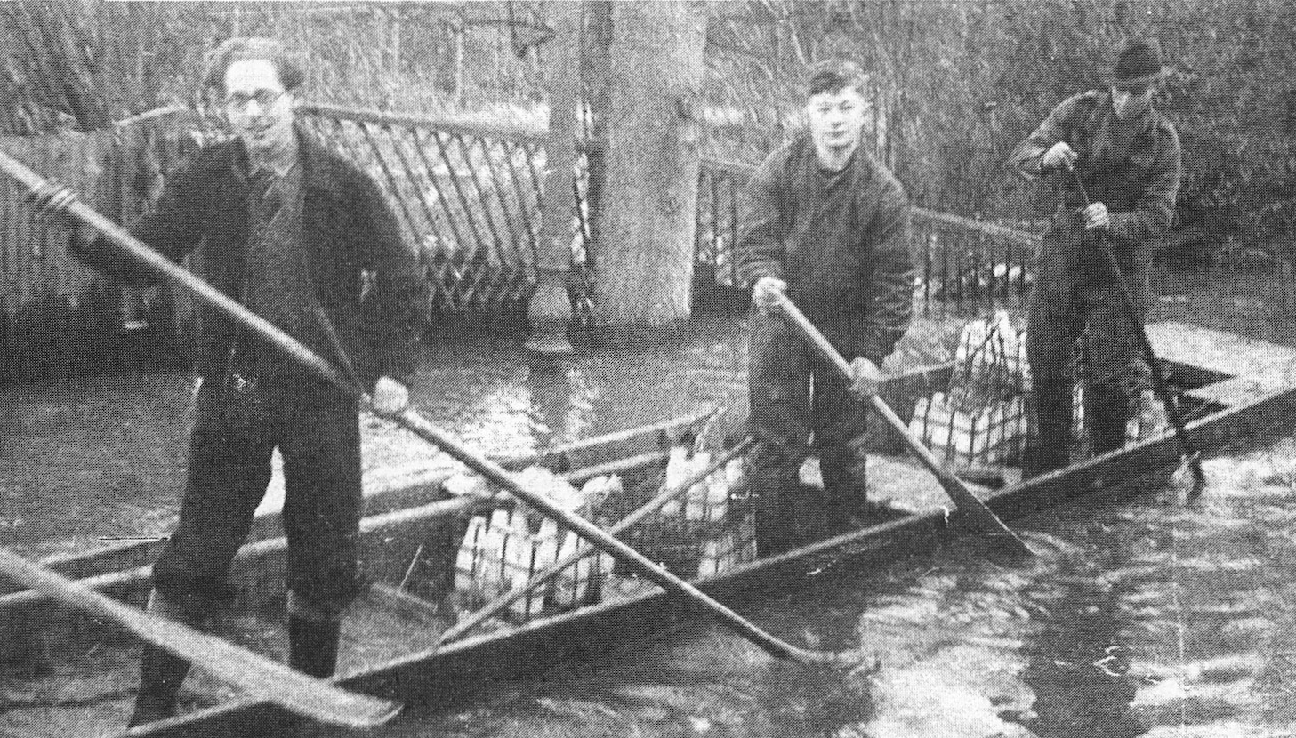 1947 Tony Good (centre) delivering milk in the 1947 floods