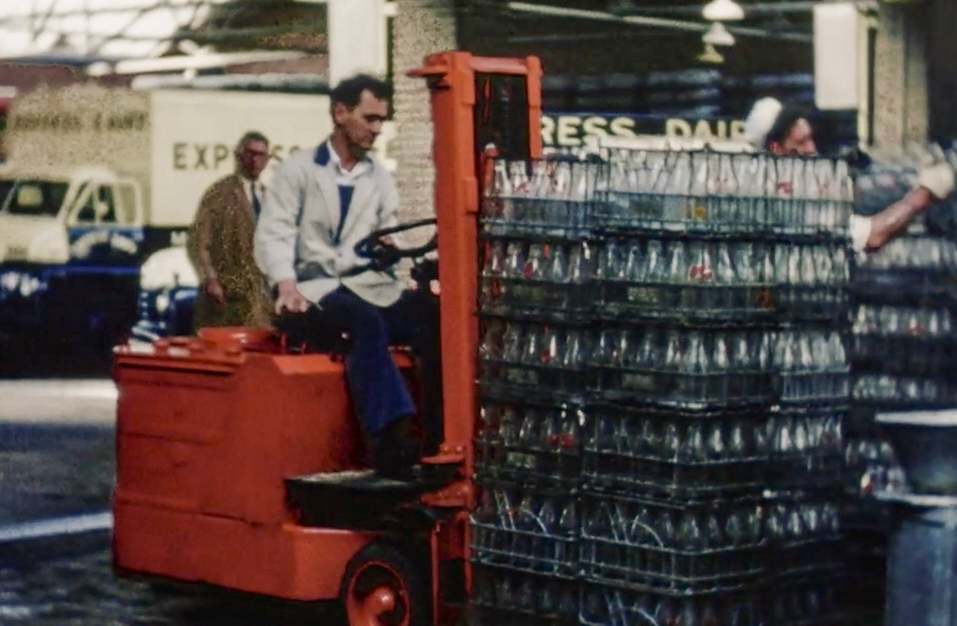 1954 South Morden Processing-unloading empties, wire crates at this time. (Stills from Express Dairy Film)