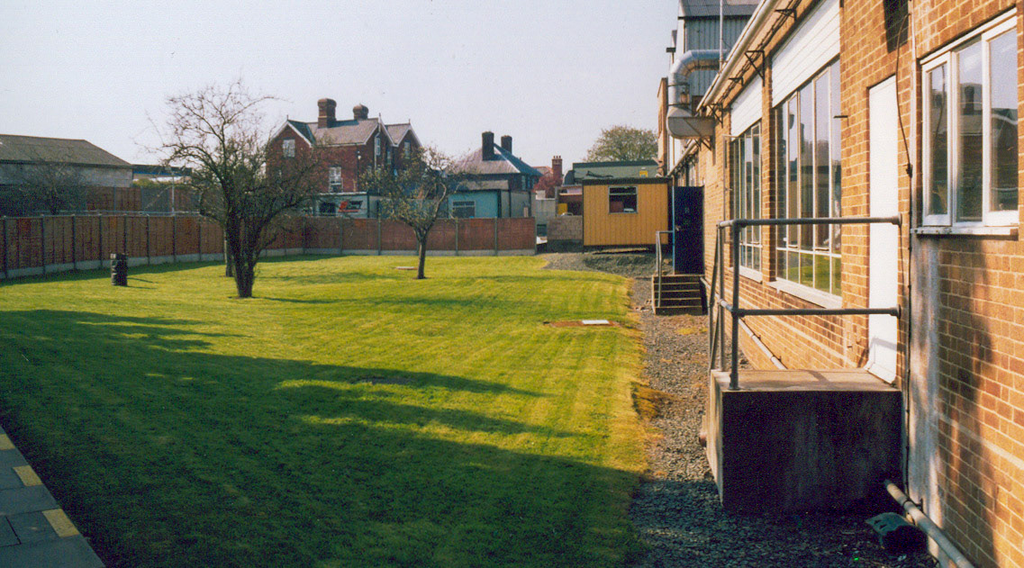 1990's Minsterley Creamery. Steve Austin comments "Rear of the canteen. Martin Jones adds "I remember when part of that building had two snooker tables in for the workers.". Dave Jones mentioned "Good old days before the dessert factory spoiled everything in the whole factory..." Patrick Taylor adds "When George Jones's family kept the garage this area also belonged to him as part of his garage, and many years ago on this parcel of land there were two tennis courts."