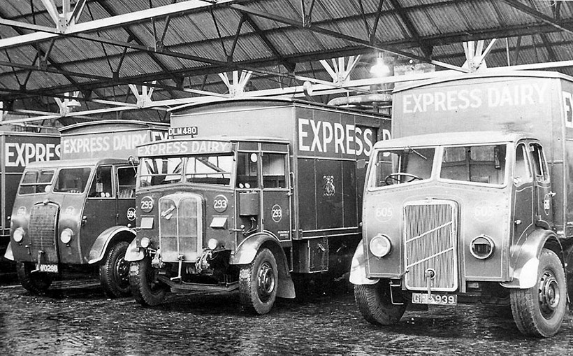1945 A scene at Cricklewood bottling depot around late 1945 with, on the left, fleet no 594, AWO 298, a 12-ton Foden ‘DG’, first registered in Monmouth in April 1936, on chassis no 17024. It was purchased by the dairy in July 1943, from Fodens at Sandbach, for £1,751, with the box body being fitted at the end of the year at a further cost of £352. It passed to Birds at Stratford in March 1947, for £650. On the right, the ERF fleet no 605, GRB 939, on chassis no 2230, was first registered in Derby in August 1940. It was obtained from Murphy Bros of Leicester in August 1943, for £3,200, then received a new box body in December 1943, costing £378. Disposal followed in July 1947, again to Birds for £1,000. In the centre was perhaps a lone survivor of the many AECs to join the Express. This Mammoth Major, fleet no 293, chassis no 366099, DLM 480, was first registered in December 1936. At the time of its purchase, two Sentinel steamers, waggon nos 1581/82, fleet nos 37 & 38, were taken in part-exchange, at £20 each. (Courtesy The Express Dairy Motorised Fleet, Allan Bedford, Heritage Machines)