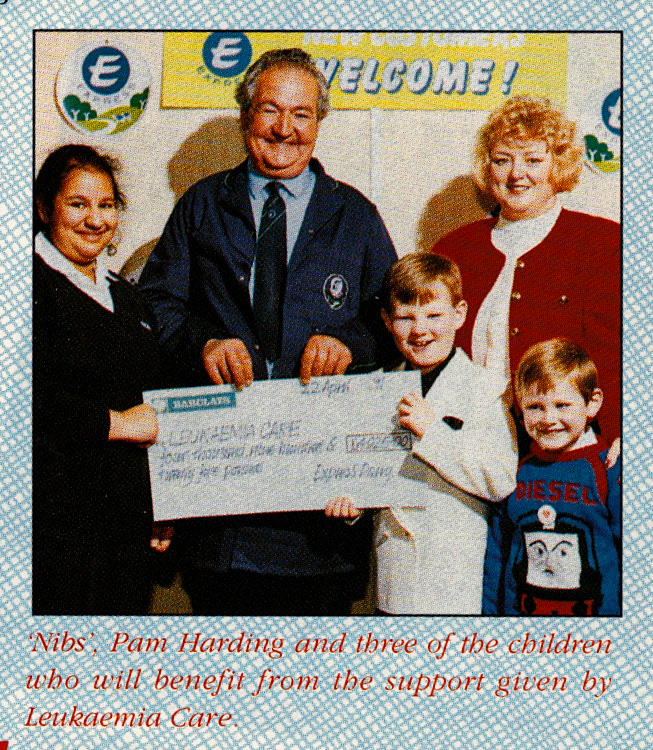 1991 St Alban's - 'Nibs' hands cheque for Leukaemia Care  (1991 Summer Tops Magazine)