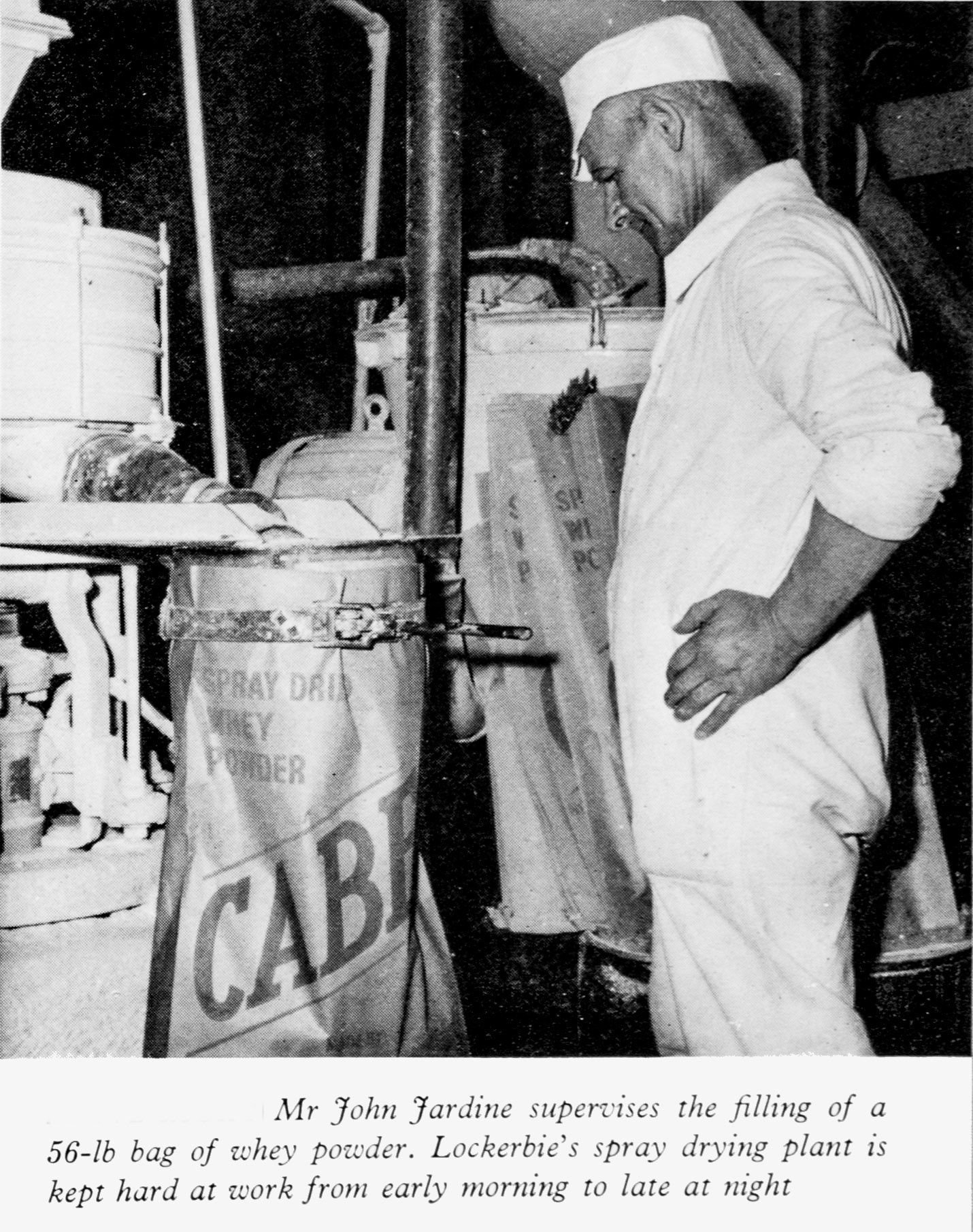 1961 Lockerbie operator Mr John Jardine bagging whey powder. (Express News Autumn)