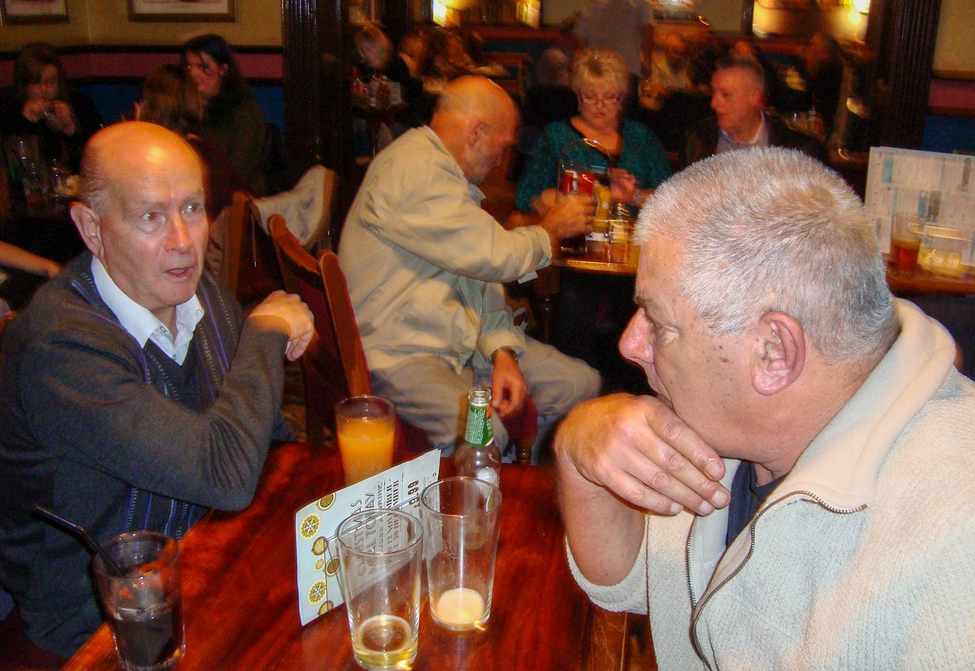 2014 Exeter Staff Reunion-Martin Evans identifies Dave (David Hodge) in the foreground, opposite him on the left is Bill Mitchum. Behind in the beige jacket is Derek Howland, sitting with Geoff Bowditch and his wife. Nina Hodge adds "My lovely Dad, David Hodge, he passed in October last year (2023). He had happy memories of this." (Courtesy Phillip Budd)