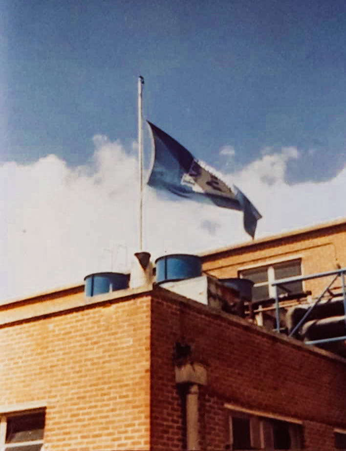 1970's Crediton - the end of churn collection. Kym Moore commented "Flag at half mast, the last churn delivery was the end of an era." Linda Hallett commented "My first proper job 1972-73 working in the lab - would have to go out when the lorries came in to sample the milk. Gillian Williams commented "I worked at the lab during the summer of 1970. Like you - testing the milk that came in in the churns - donning the big boots and ladle - down to the hopper where you had a grab the sample of milk before the gates opened and the milk disappeared. Great job - paid well too - £10 a week which was good money...." (Courtesy Kym Moore)