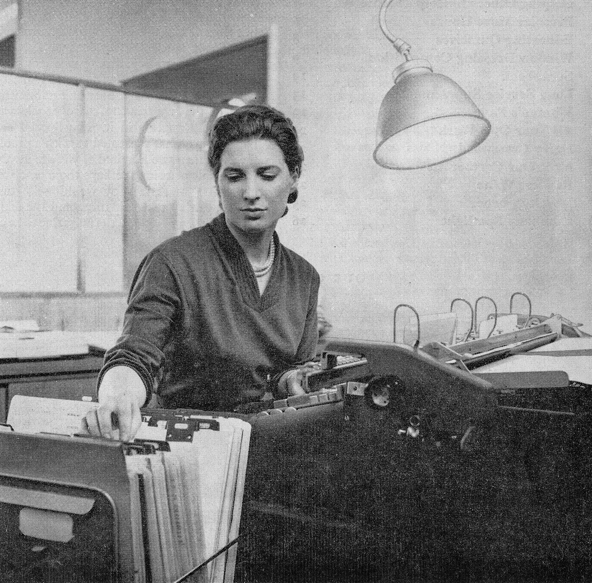 1957 New Premier Supermarket HQ at South Ruislip, with Mrs Jean Deitch operating a National 32 accounting machine. (Express News Front Cover, Autumn)