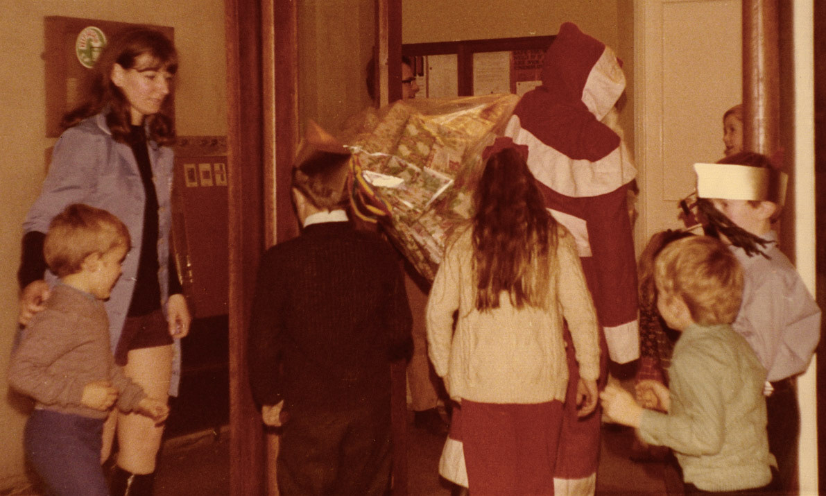 Matthew Taylor comments "I remember Christmas parties in the canteen at Minsterley when I was little". Dave Evans identifies John Betton going through the door on the left, Linda Rodgers with the long hair and me with the hat on his face. (Courtesy Joe Lyons)