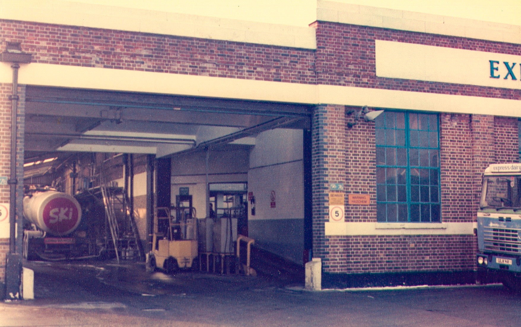 1980s Bromley Processing frontage and nearby roads.Paul Batchelor comments "The ramp by the forklift truck was made wider when the bottling centre closed, ready for electric vehicles to move from the retail depot next door, after the battery chargers were installed. We also moved out of our EVM workshops at Sundridge Park into there, but this was only temporary as I was working getting the new Bromley depot in Old Holmesdale Road ready-installing 75 brand-new battery chargers ready for the closures of other depots to move into. Then I began working on another new depot in Anerley with another new 75 battery chargers, ready for other depot closures around that area. It was a huge project but all went as planned." (Pictures by Reg Ball, on loan from Colin Bristow)