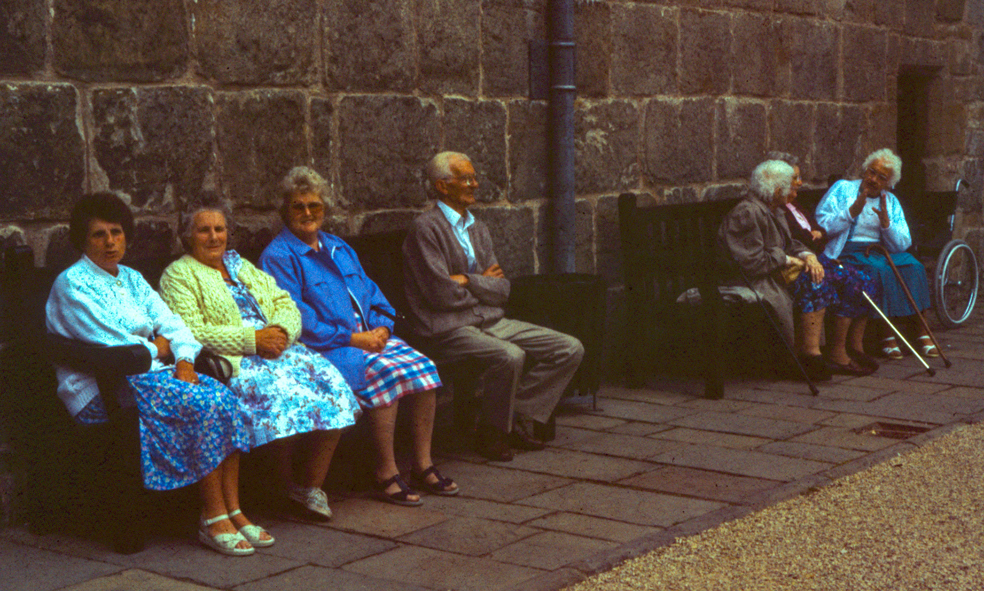 1995 Darby and Joan Chirk Castle visit. Ben Samuels identifies Mrs Holloway, Dorothy Moss and Doreen Williams. Malcolm Williams comments "My mother in the blue coat, Mrs A. Holloway next to her, with I believe Dick Davies". Rachael Lou Lew adds "My Nan and great Nan". Janice Davies comments "Molly Rowson, my Auntie, far right hand side sitting by the wheelchair-she must of been telling them a story looking at her hands as she always used her hands to express what she was telling you, bless her."(Joe Lyons 35mm slides)