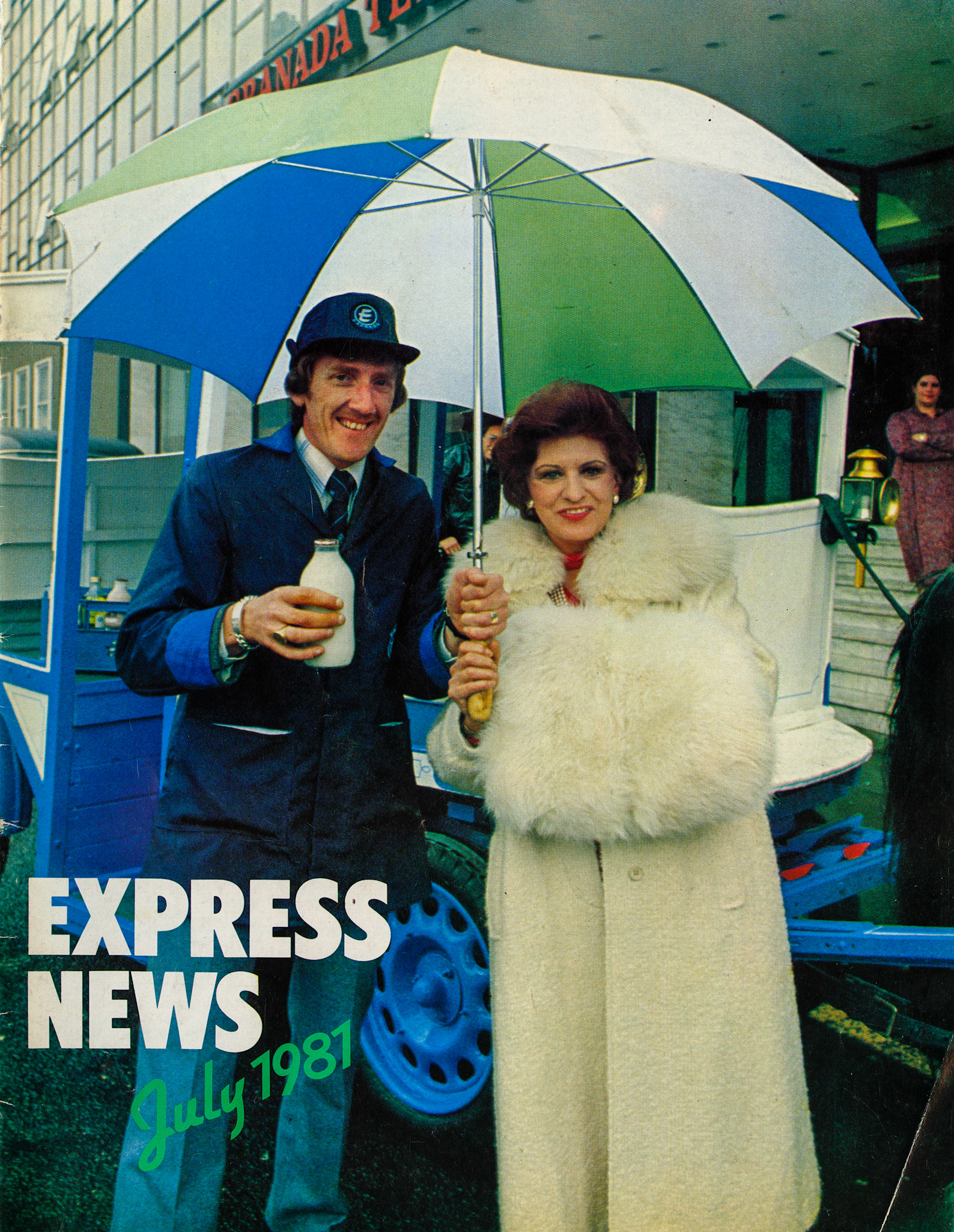 1981 Manchester- Pat Phoenix from Coronation Street  in Manchester shelters from the rain with Northern Region's Personality Milkman of the Year Gordon Mayhew