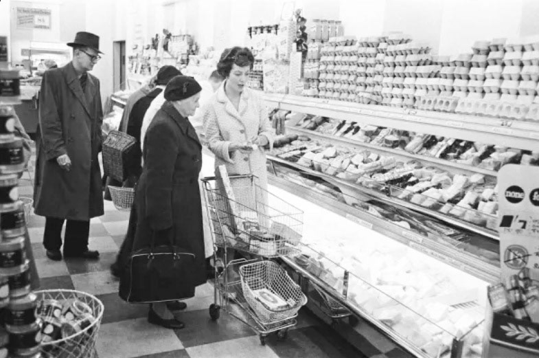 1958 "Shoppers browsing the dairy counter at a newly opened self service food store in North London, probably Premier Supermarkets, 14th November 1958 (Courtesy www.mediastorehouse.com)