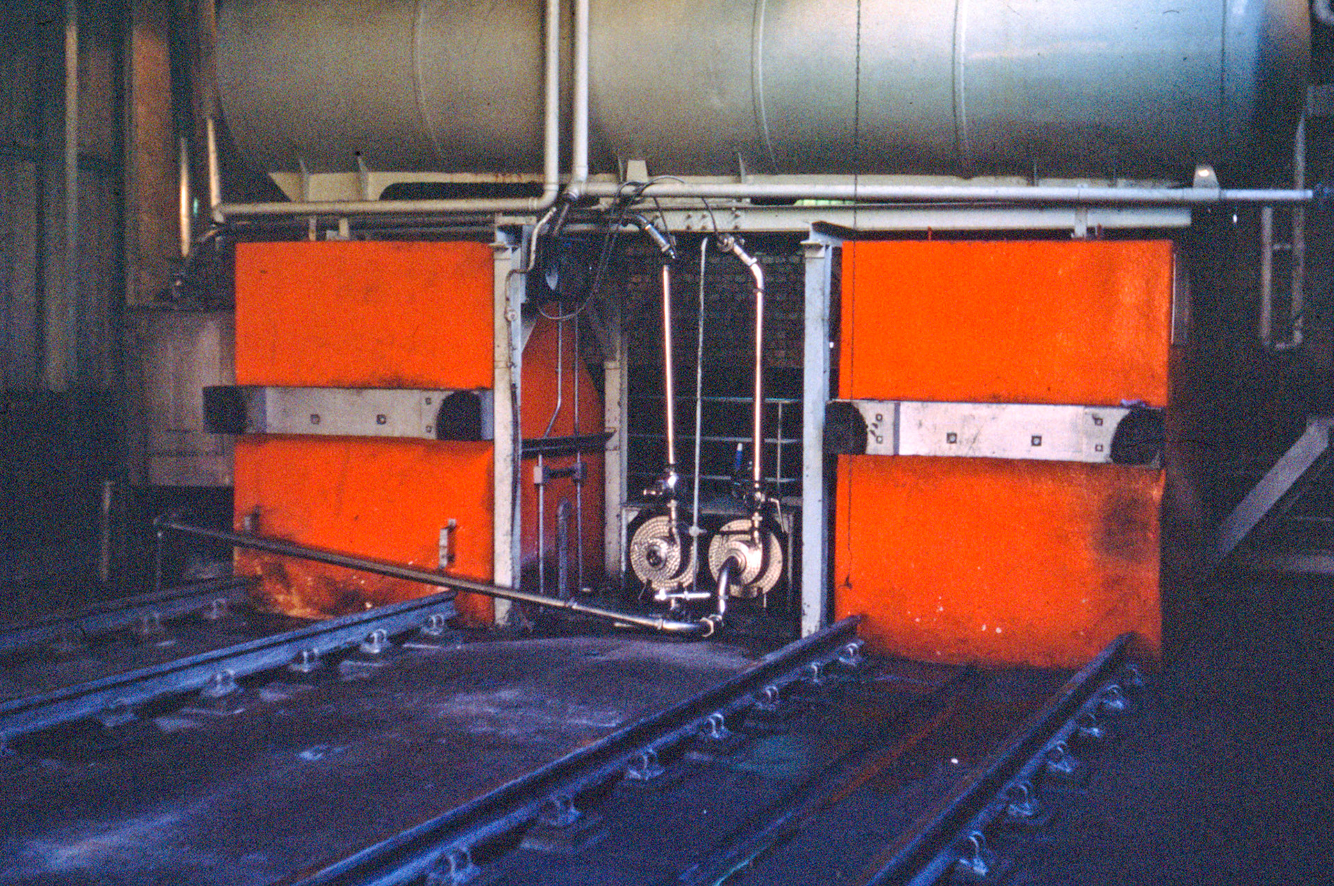 1970's South Morden-Substantial concrete buffers at the end of the rail siding, with CIP tank above, just prior to removal.