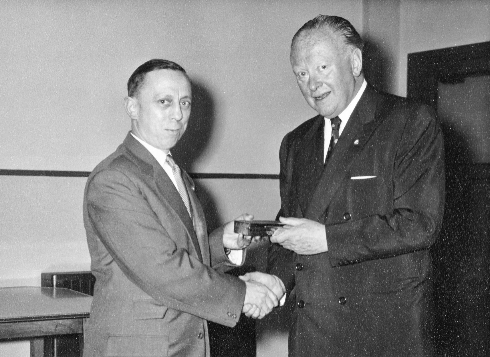 1957 Len Frost and Walter Nell at the Long Service Awards 1957. Roger Frost comments "Walter Nell presenting my father with a silver cigarette box. From the time my dad was demobbed in 1946 until the mid 1960s our family lived in flats over Express Dairy shops. It was only when all the shops were being closed and the properties and leases sold off that my parents were rehoused in Council accommodation." Roger Frost comments "Walter Nell presenting my father with a silver cigarette box. He started working for T.H Lewis in Chalk Farm in 1933 and apart from his war service from 1940 untill 1946 he stayed with them until he retired. From being demobbed in 1946 until the mid 1960s our family lived in flats over Express Dairy shops. It was only when all the shops were being closed and the properties and leases sold off that my parents were rehoused in Council accommodation." (Courtesy Roger Frost)