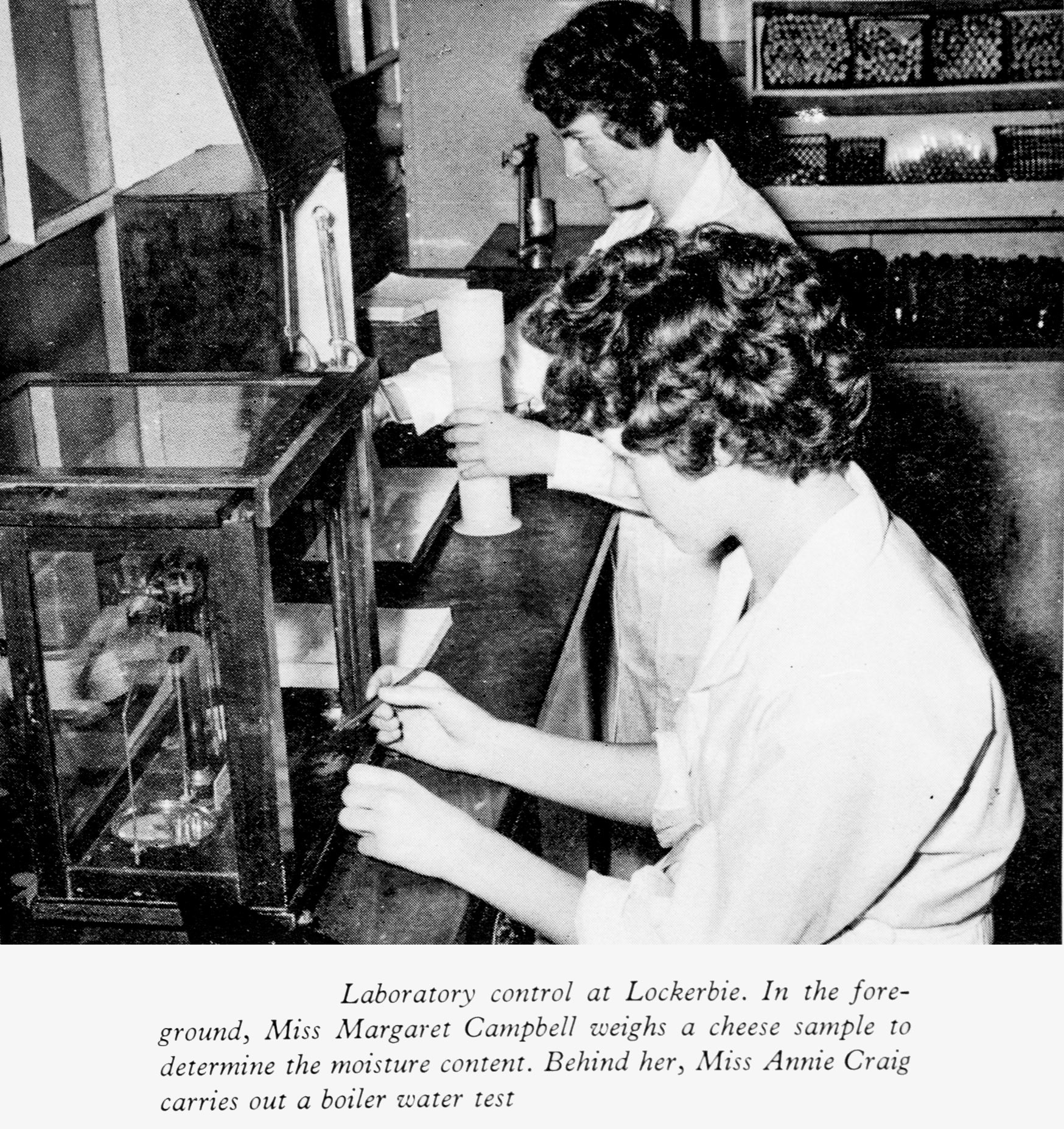 1961 Lockerbie Laboratory with Miss Margaret Campbell weighing a cheese sample and Miss Annie Craig carrying out a boiler water test. (Express News Autumn)