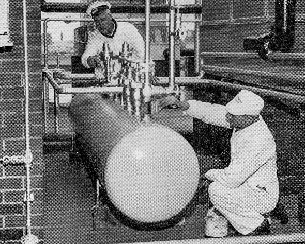 1968 Wakefield. Roy Scholes and Ted Ottewell add a touch of blue and silver to the compressor plant. Both joined our Manorcroft Dairy in 1948. (Express News Summer)