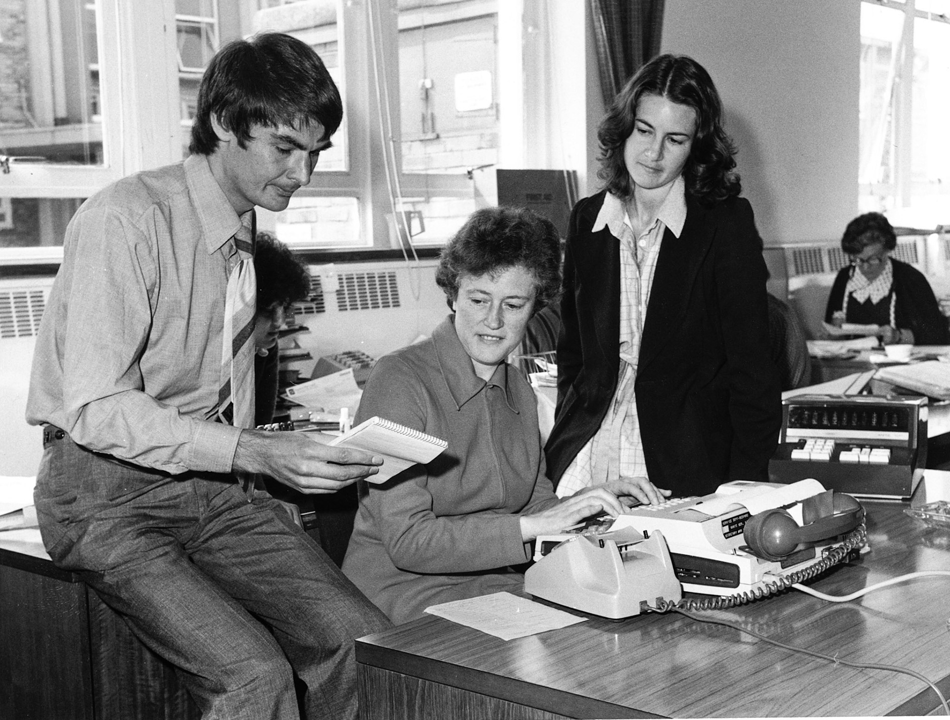 1978 Peter Roper, Joan, Angela Stoch from Management Services using Texas Instruments with acoustic coupler to GRIP mainframe running FCS
