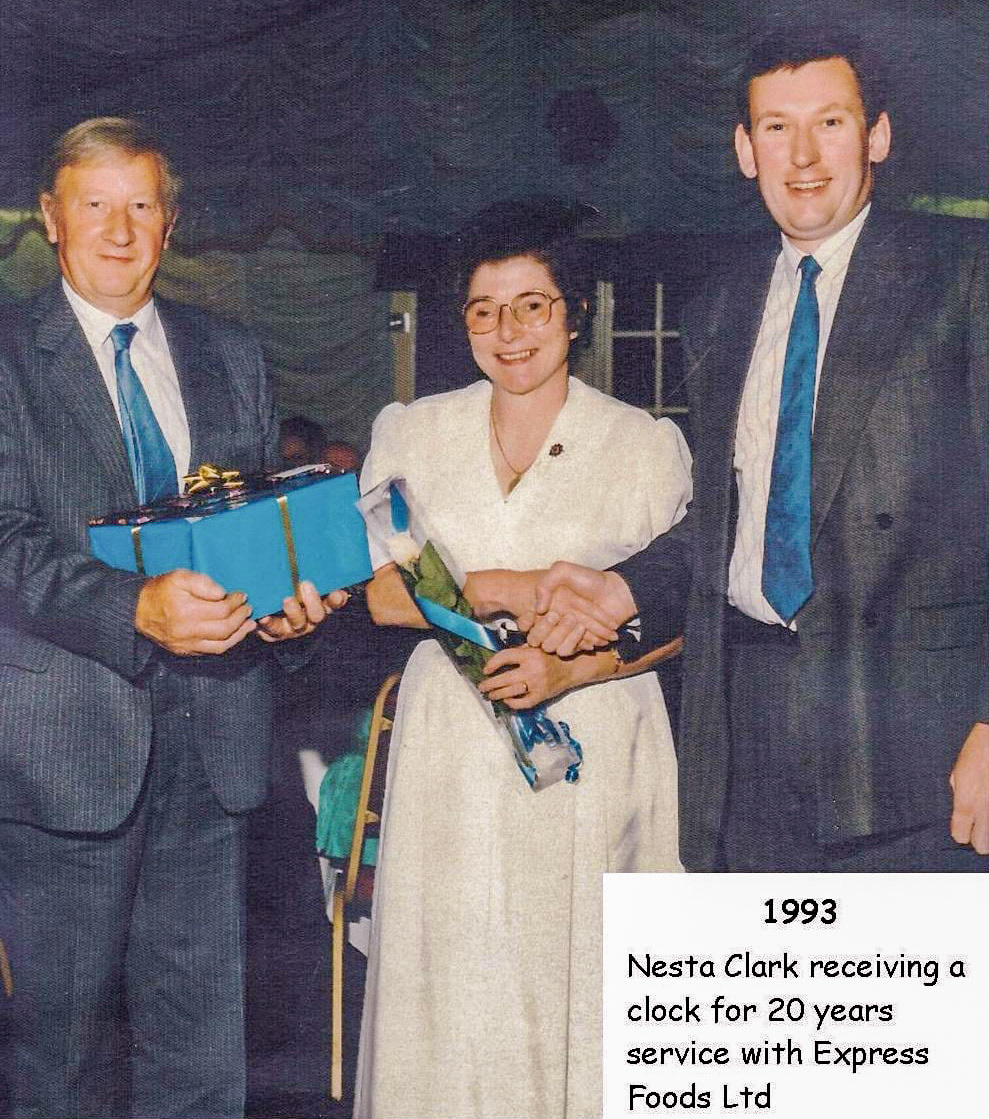 1993 Long service awards night at Express Ruyton, with Nesta Clark receiving her 20-year award. Dai Williams identifies Nesta's husband Vernon on the left, and Jeremy Quested, Director-of Operations, on the right. Angela Dawn Davies comments "I was an apprentice in the office and Nesta Clark was my main mentor-she was amazing as was everyone else in the office. Was a great first job." (Courtesy Margaret Lycett, Ruyton Revisited FB Group)