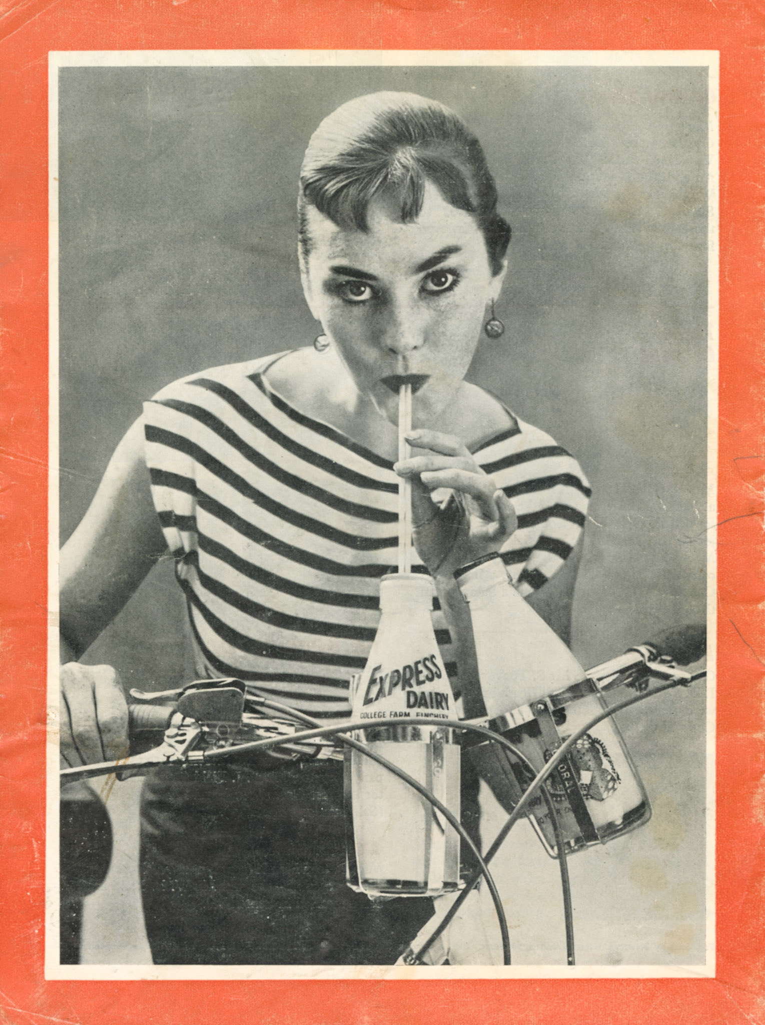 Express News Summer 1956 Back Cover-Dancer Eileen Elton dismounts from a 2-pint Triumph in order to take on fuel