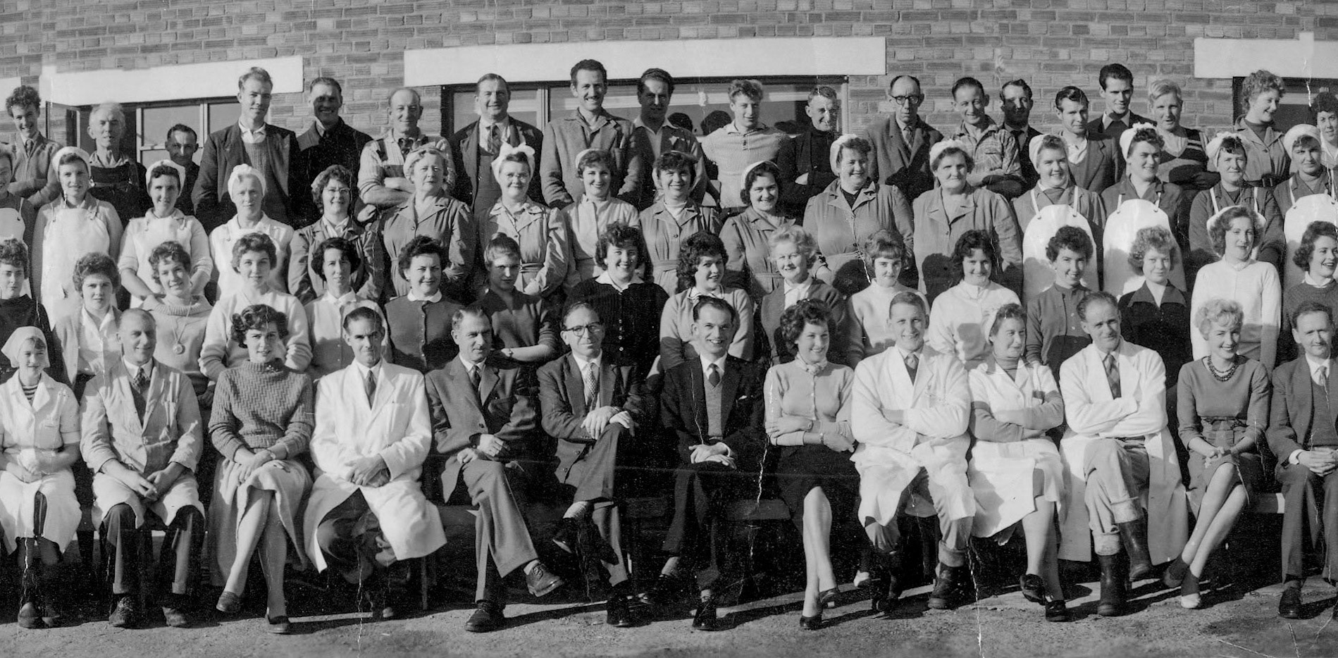 1959 Goldhanger Fruit Farm employees and staff. Front row L-R: Len Carter, Reg Clarke, Mr Tom Lanson, Ken Harredence, ?, Connie, Tony Harrow, Margaret Quy, Lindsey Todd, ?, ?. Second row far left: Joyce Lingwood, Third row, fifth lady from left Betsy Page, ?, Nora Hume, ?, ?, ?, Rose Walker, ?, ?, Marigold Lewis, Back row L-R ?, ?, Freddie Ruffle, Ernie Baxter, ?, ?, P Seaborn, Don Moorse, ?, Richard Seabrook, ?, Derek Blyth, Brian Radcliff, Sid Norris, ?, ?, ?. (Courtesy Karen Tuke, Tolleshunt Major in Words and Pictures old Photos on Facebook)