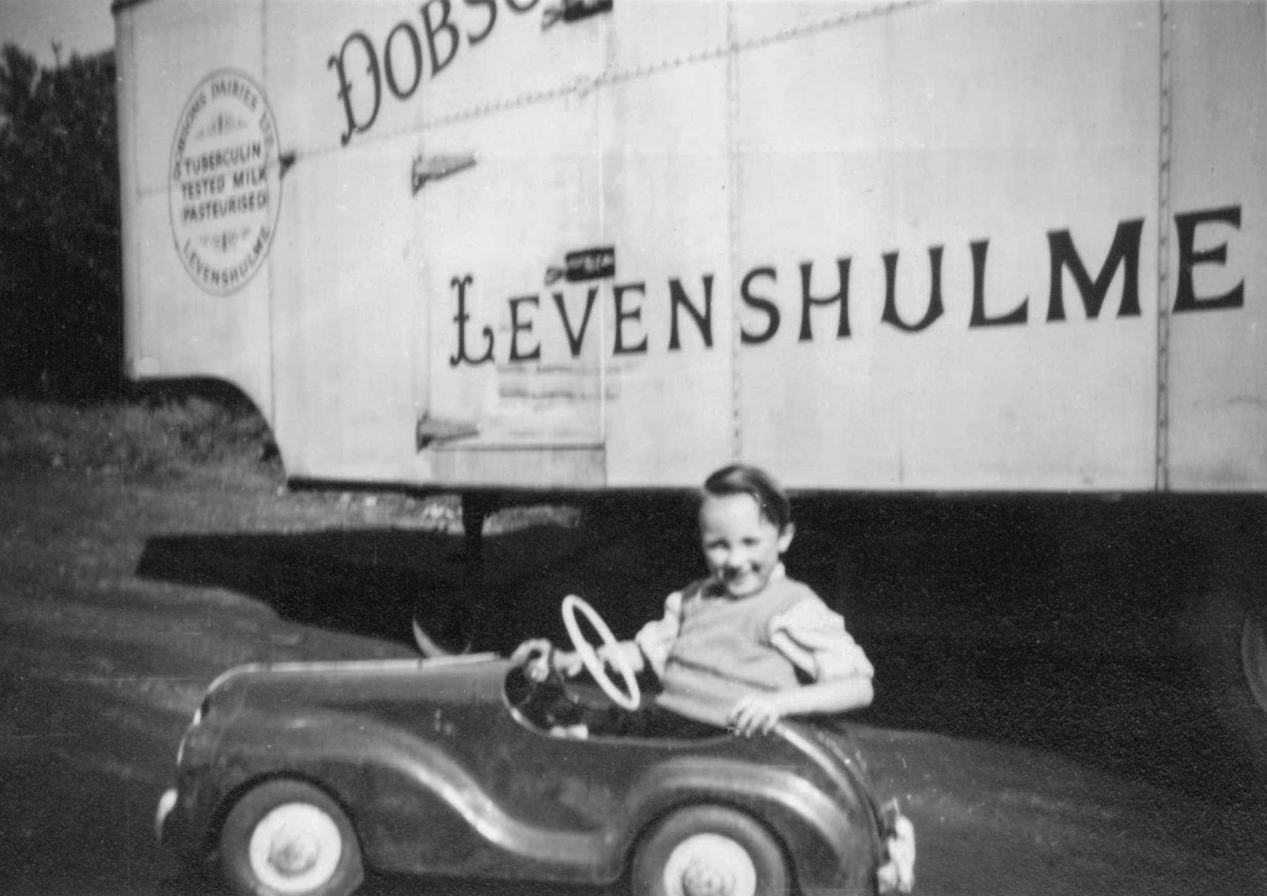 1950's "Peter McLouglin was a popular kid around Lloyd Road! Here he is seen, with his posh pedal car, alongside a Dobson's articulated van." (Courtesy George Nixon and Peter McLoughlin, Levenshulme History Then & Now)