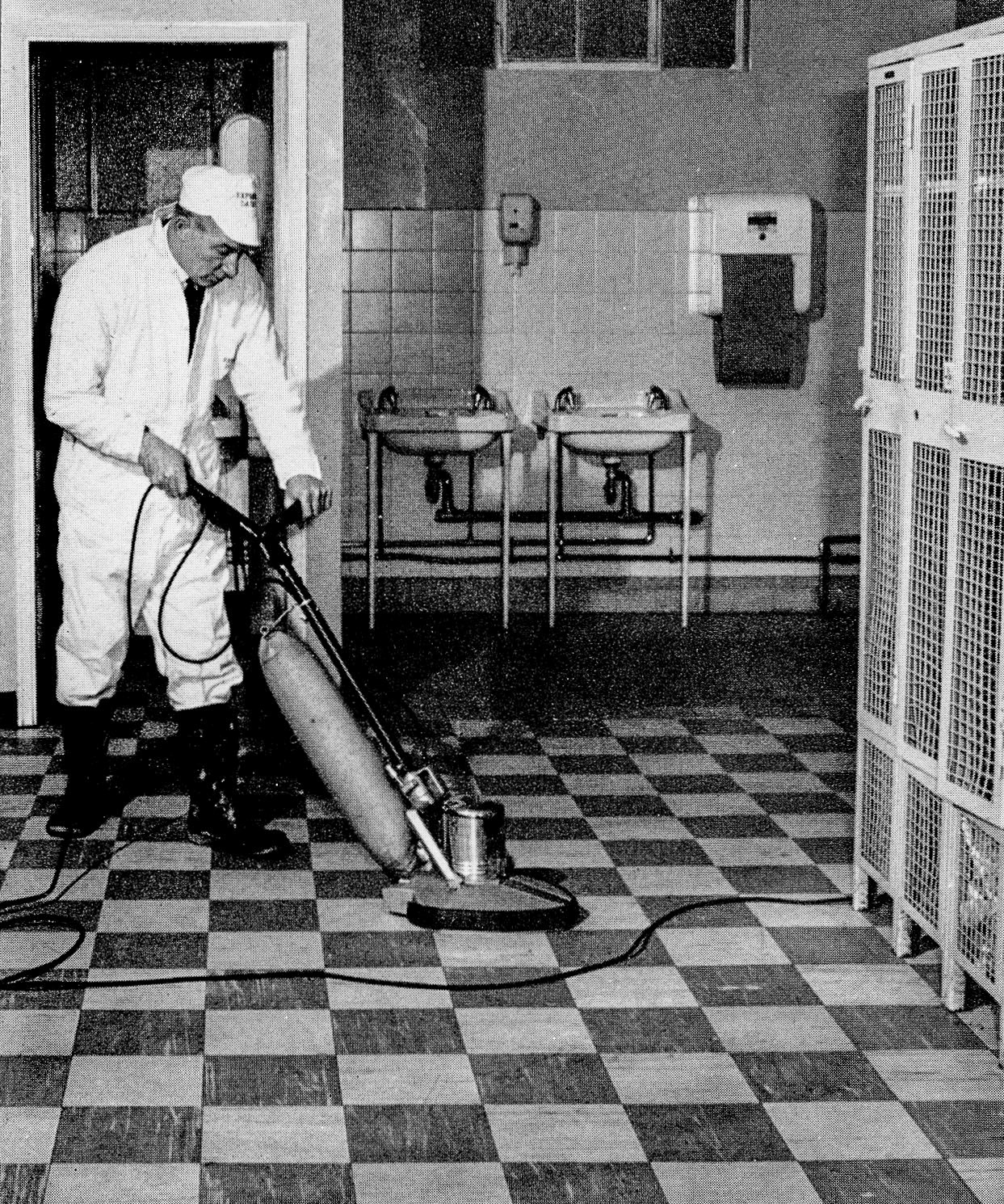 1968 Wakefield. Yardman Jack Child polishes the locker room floor. (Express News Summer)
