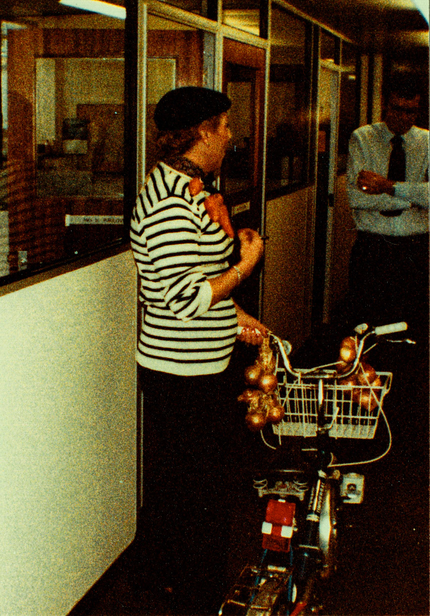 1983 November - Milk Division trip to Boulogne. Beryl Purslove explaining the Carrot Necklace to Dennis Watson(Courtesy Beryl Purslove)