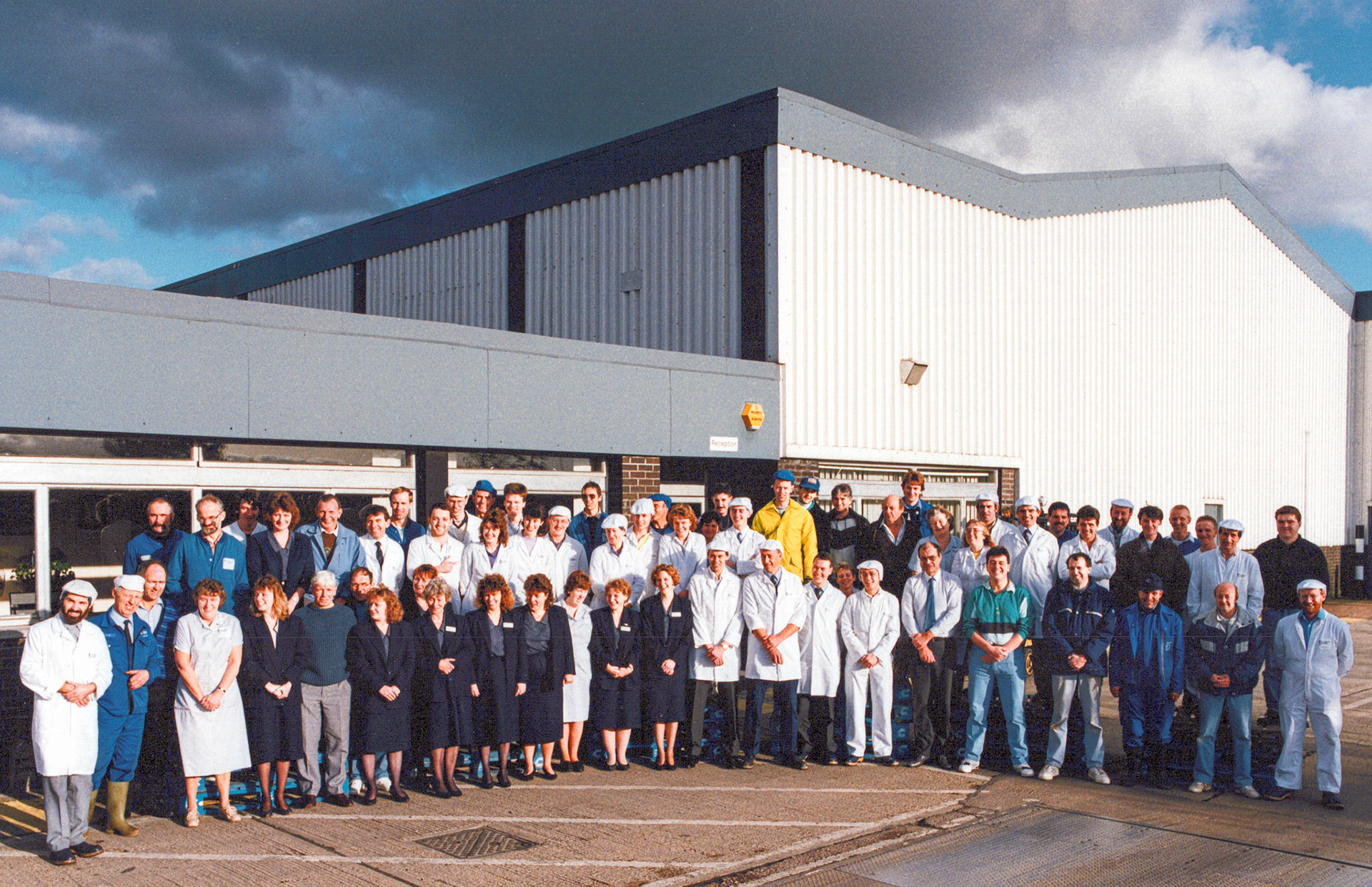 1990 Honiton staff from Ottery Moor Lane Lins Marie comments "Thanks for sharing this. Always hope to see my grandad in some of these pictures and finally have 🙂 He passed away a couple years ago", Mike Morel comments "Wow that was a long time ago, but nice to see. I am last on the right, although the beard is nowhere near as red nowadays!" (Courtesy Allhallows Museum)