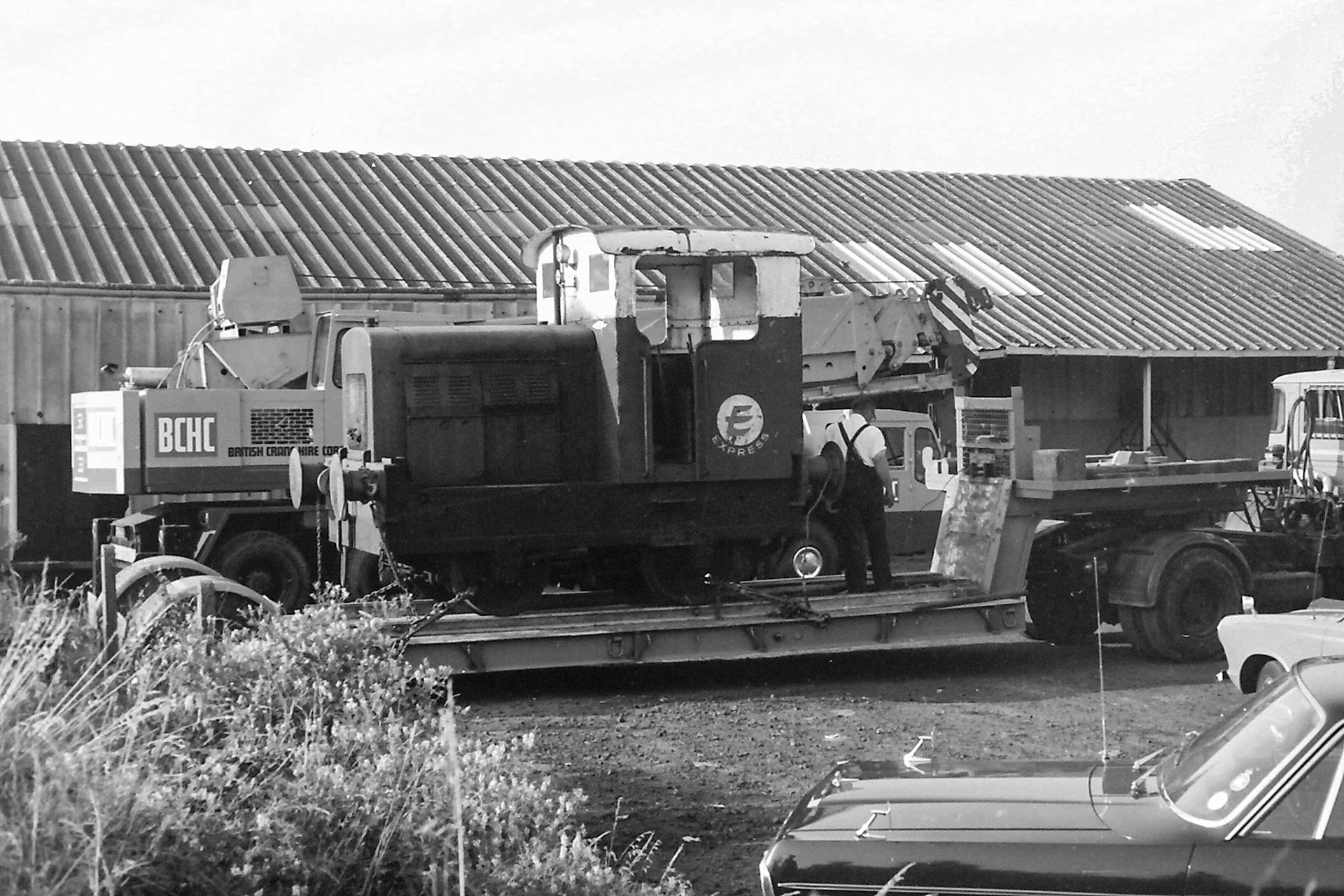 1972 Ruston 48DS 235511 being lifted out by crane into the car park on 26th July to be taken by road to the Ashford Steam Centre. Possibly Brian Wallis, plant engineer, directing the crane in white shirt?  Raffaele Ralph Phillips comments "This shunter was in use when I joined the company in 1970-as an apprentice vehicle electrician I had to check the batteries and some basic electric circuits whilst in service, also checking the charging system on the shunter which involved starting her up! (Picture by Sam Jones, courtesy Geoff Smith)