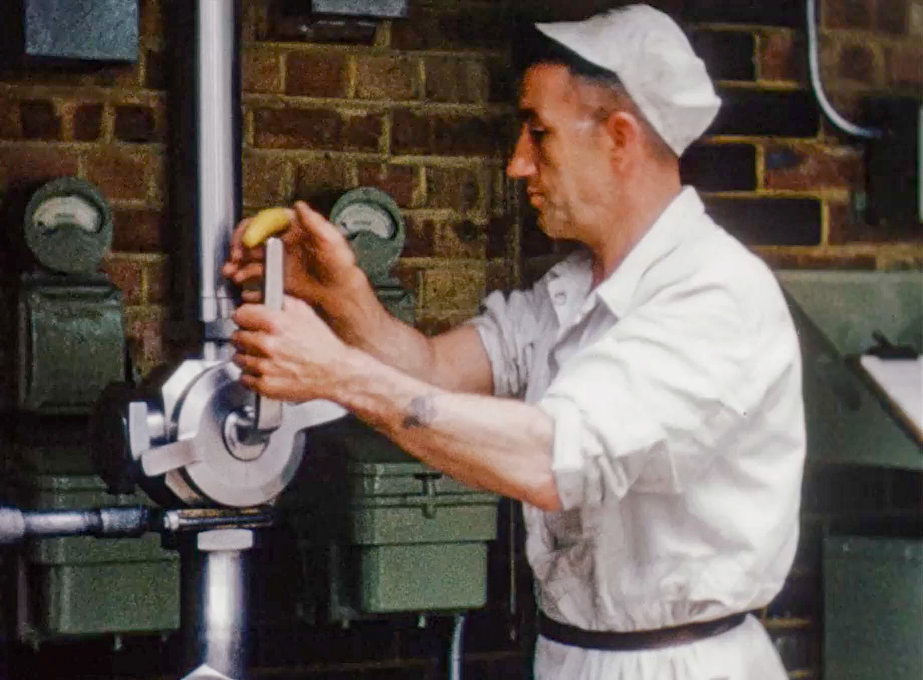 1954 South Morden Processing-pumping milk from tanker reception to the pasteurising floor, where there were 14 3000-gallon tanks at this time. (Stills from Express Dairy Film)