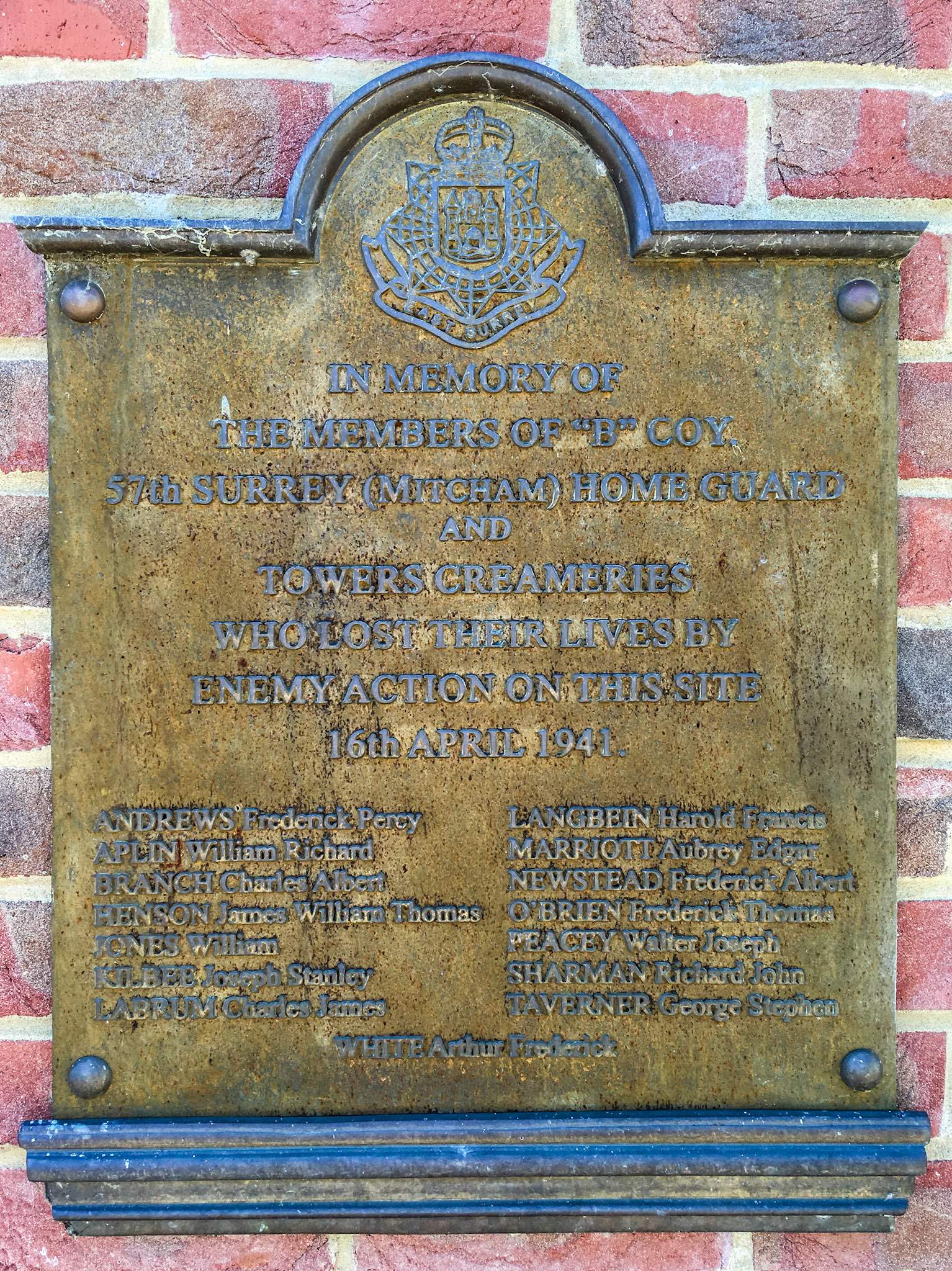 1941, erected 1962. Tower Creameries Memorial Plaque-“B” company 57th Surrey (Mitcham) Home Guard were based at Tower Creameries on Mitcham Common. On the night of 16th April 1941 two parachute mines were dropped by German aircraft, one landing on the Tower Works, which was completely destroyed. There were 15 fatalities. This plaque was moved to its current location near Commonside East when the site was redeveloped as flats. The inscription reads "IN MEMORY OF THE MEMBERS OF “B” COY. 57th SURREY (MITCHAM) HOME GUARDAND TOWERS CREAMERIES WHO LOST THEIR LIVES BY ENEMY ACTION ON THIS SITE 16th APRIL 1941". (Courtesy Mitcham History Notes)