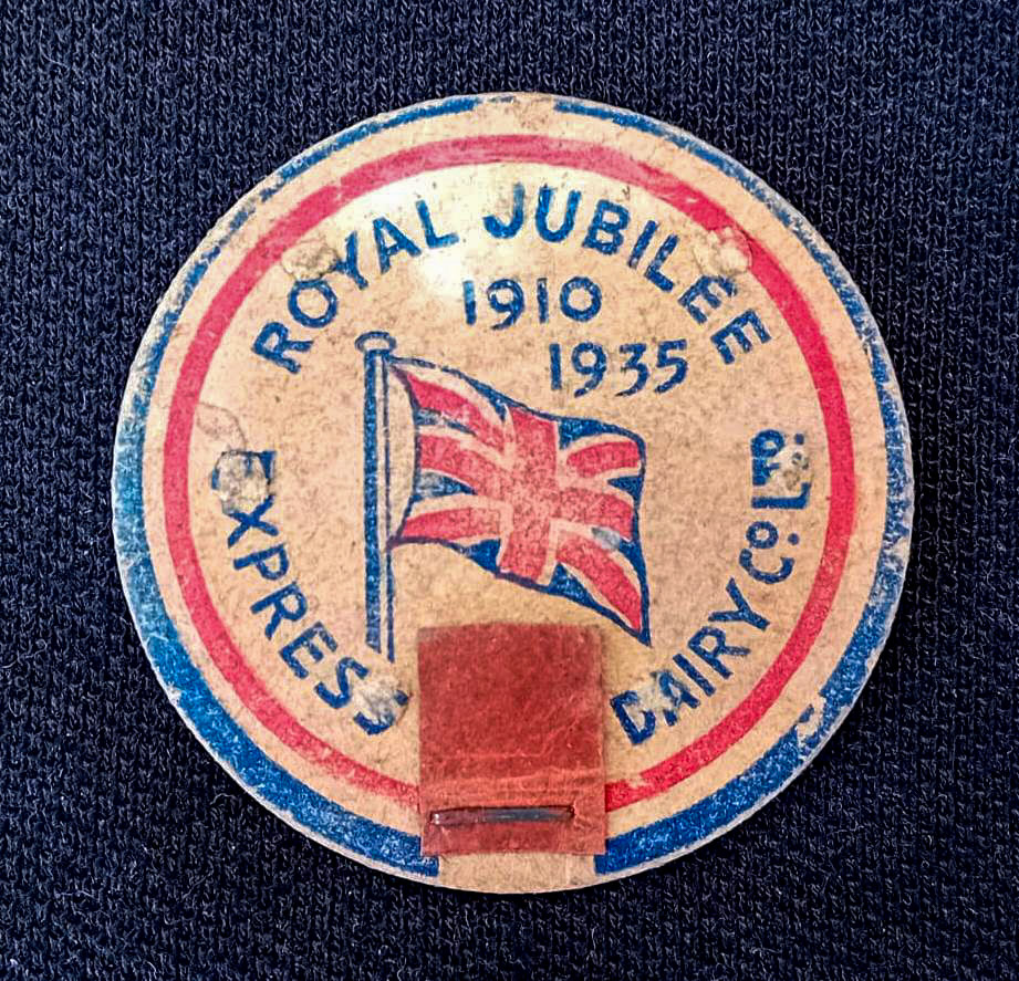 1935 Waxed cardboard disc milk bottle seal with a stapled pull tab. Express switched to foil cap seal bottles shortly after. The Silver Jubilee of George V on 6 May 1935 marked 25 years of George V as the King of the United Kingdom and the British Dominions, and Emperor of India. The Jubilee was marked with large-scale and popular events throughout London and the rest of the United Kingdom in May 1935. It was the first ever Silver Jubilee celebration of a British monarch in history. The King died less than a year later. (Courtesy Mark Hudson)