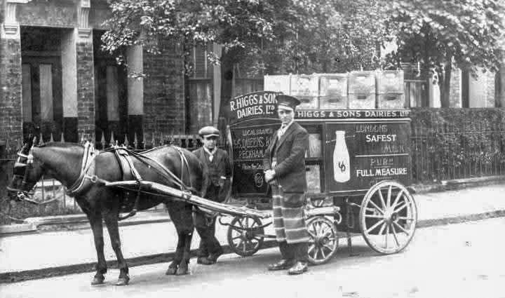 1920s Milk Roundsman, his lad and the dairy cart of Higgs &amp; Son Dairy at Queens Road, Peckham. William Davis comments "They were taken over later by Express Dairy". (Courtesy William D.T. Davis)
