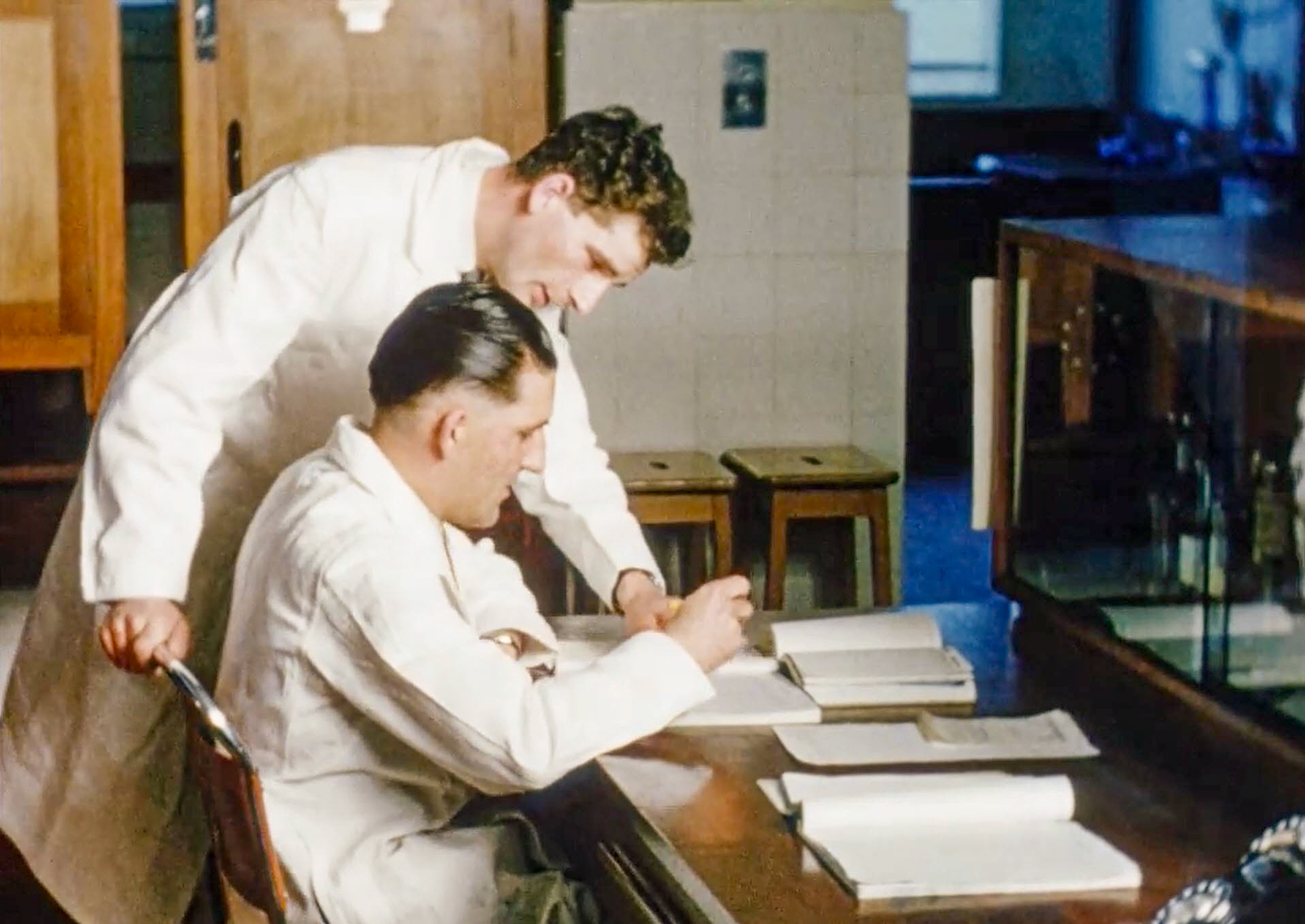 1954 South Morden Laboratory-checking test results for tanker release. (Stills from Express Dairy Film)
