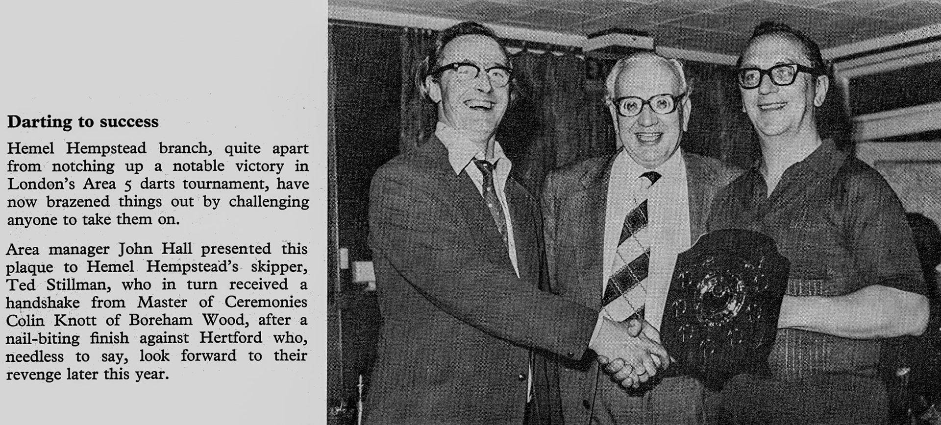 1976 Hemel win darts competition against Hertford, with John Hall presenting award to Ted Stillman with MC Colin Knott of Boreham Wood shaking hands. (Express News Spring)